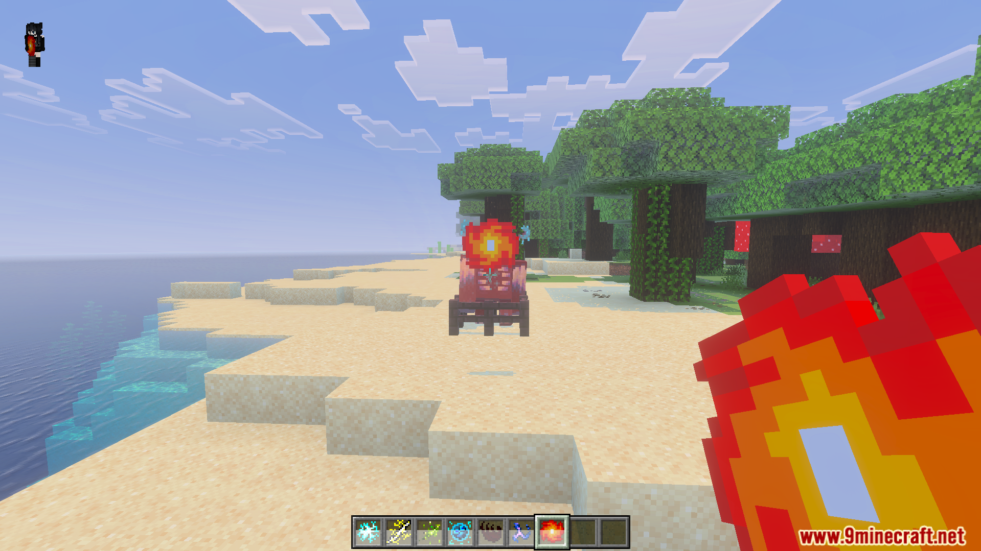 Magic Expansion Addon Screenshot 4 Player shooting an explosive fireball at a mob on a sandy beach