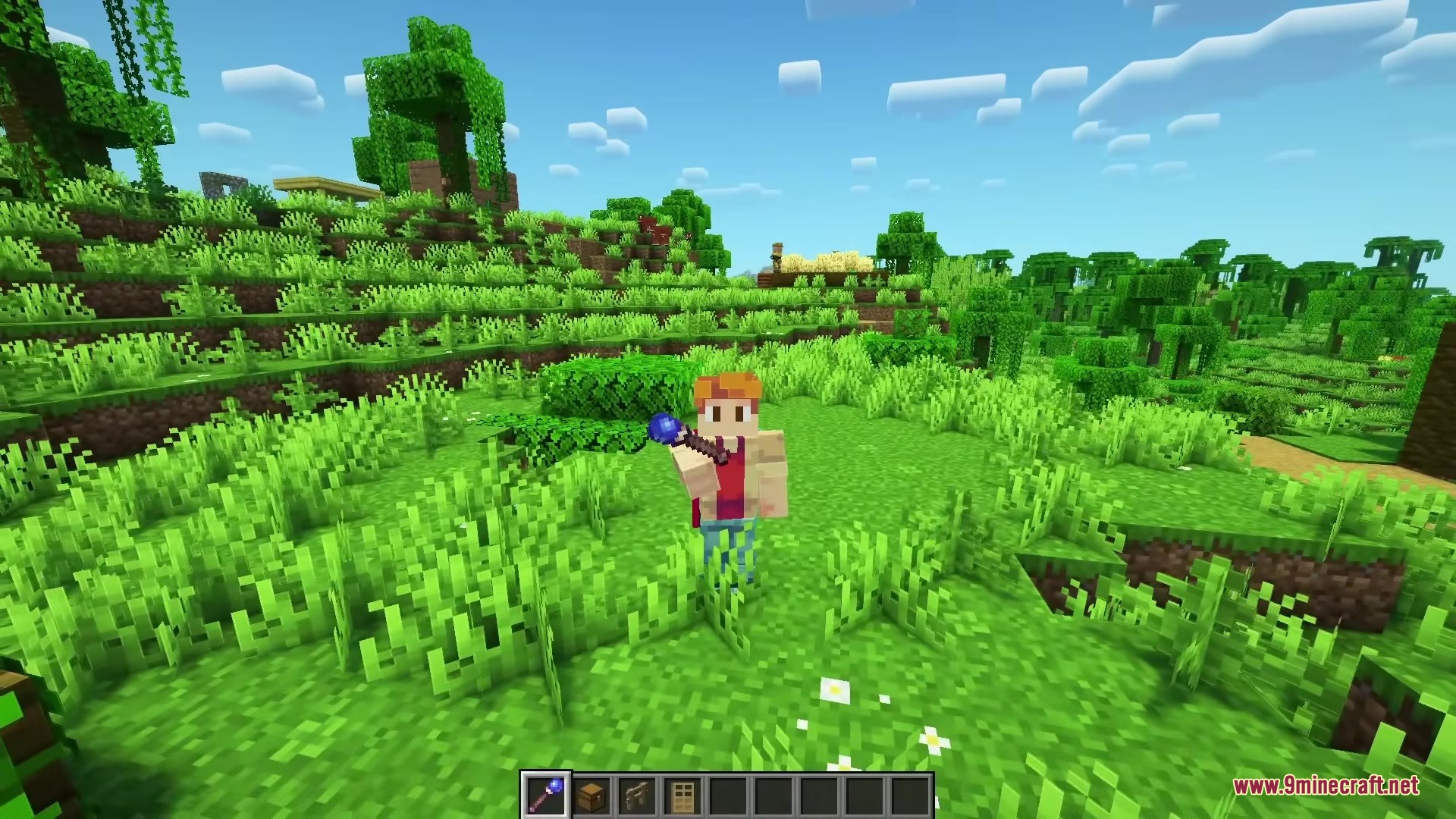 A player character holding the Magical Debug Stick wand in a green forest