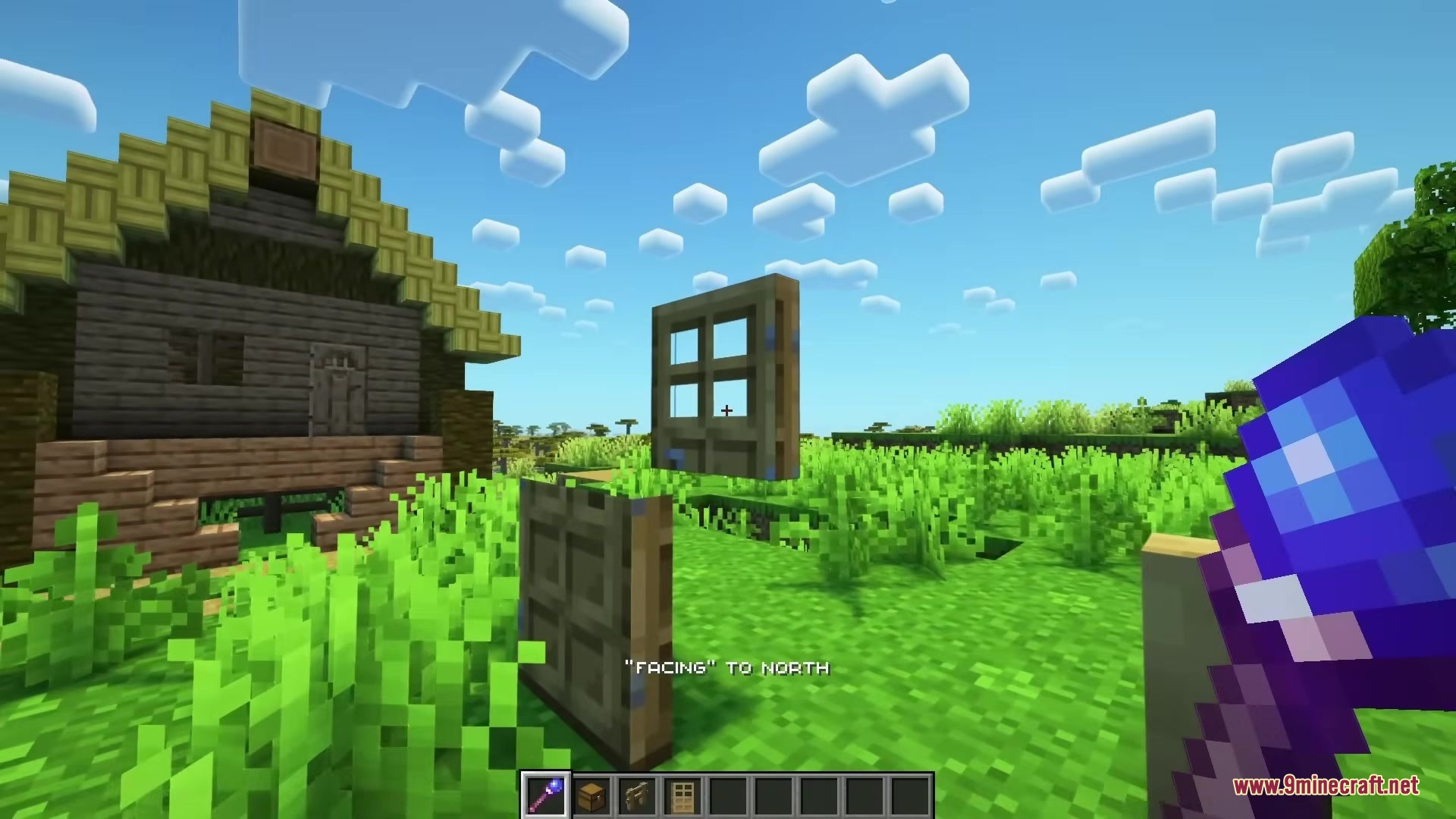 Player uses a magical debug stick to rotate a floating wooden door