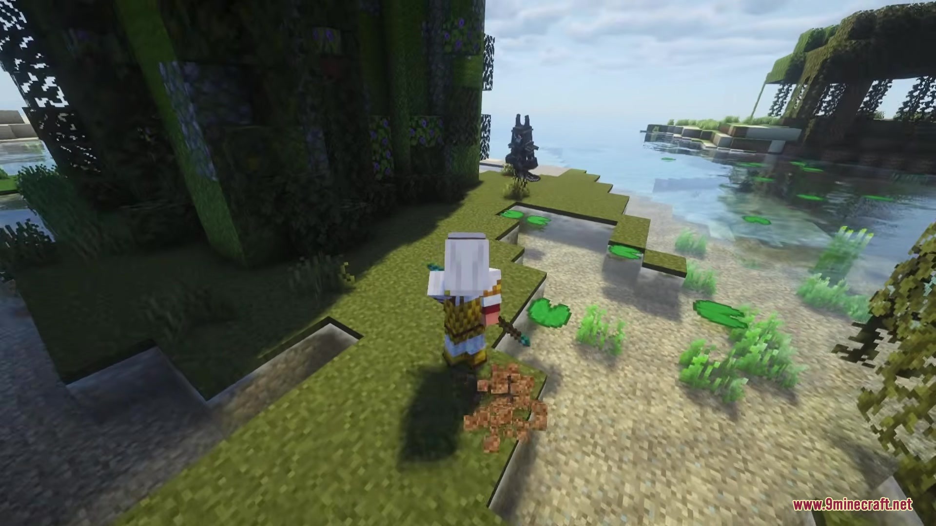 A player character in white armor exploring a swampy river bank area