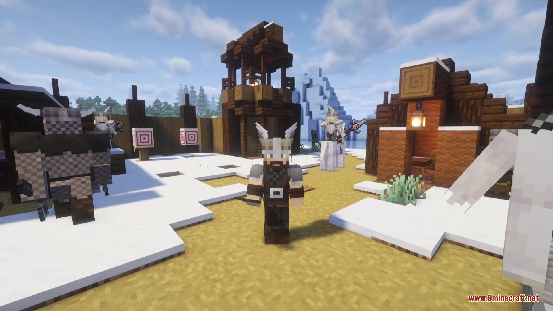 A Norse warrior stands in a snowy camp with wooden watchtowers and targets