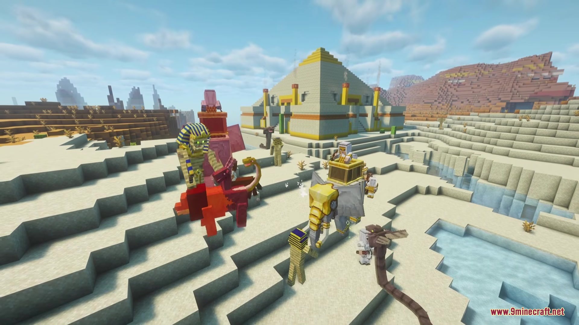 Egyptian mobs and an elephant rider gather outside a massive desert pyramid