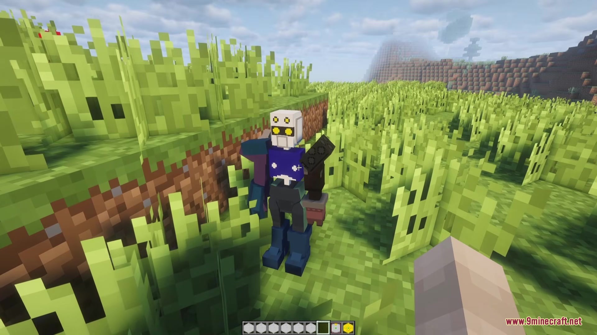 Meda Craft KD Mod Screenshot 2 A blue and white robot with yellow eyes stands in a grassy Minecraft field