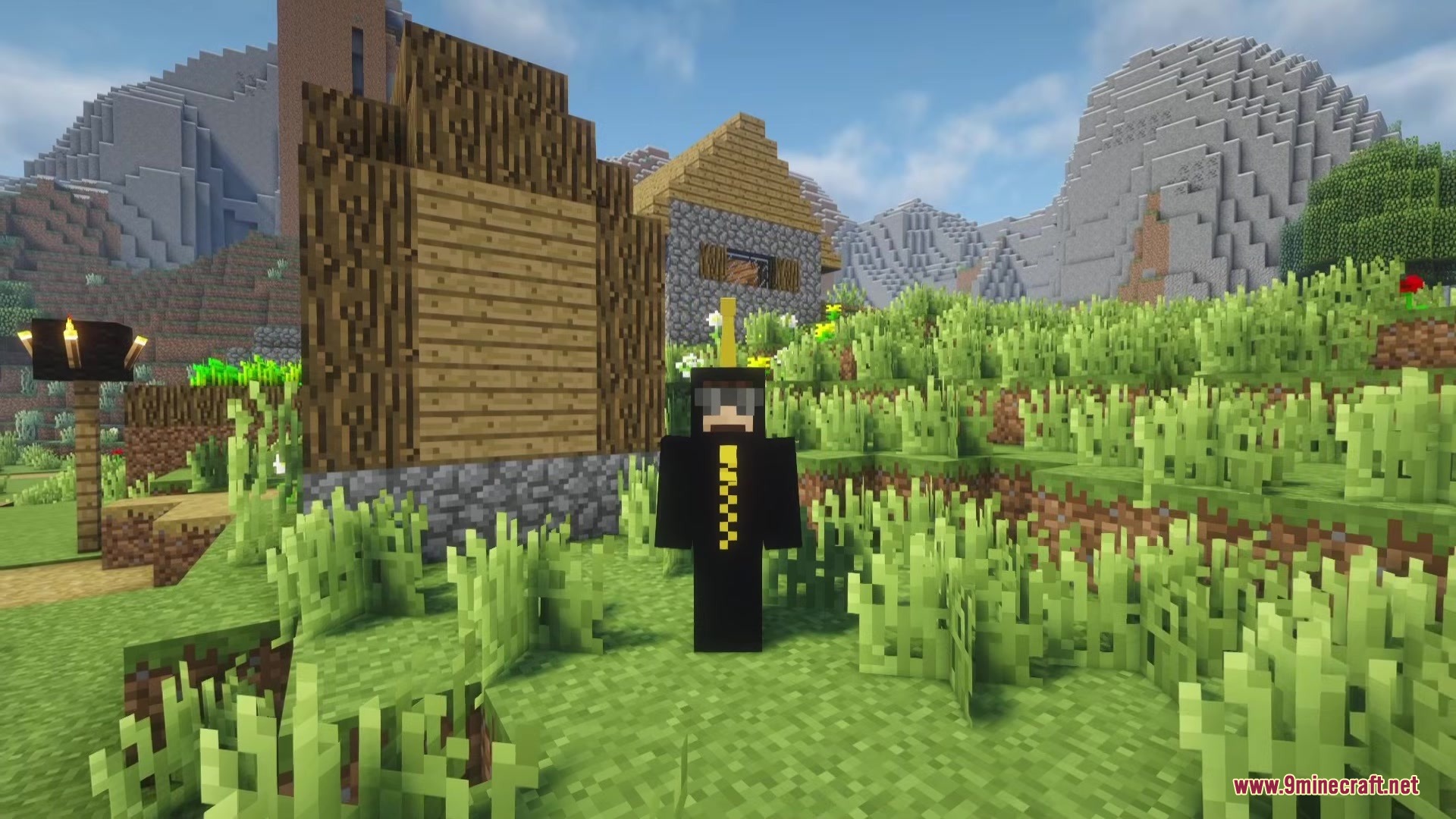 Meda Craft KD Mod Screenshot 3 Player wearing a black suit with yellow details in a Minecraft village