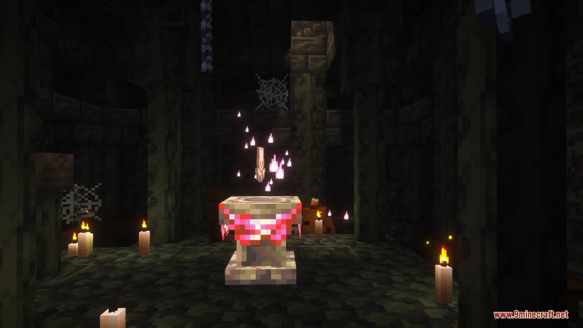 A ritual pedestal with pink particles inside a dark underground stone structure