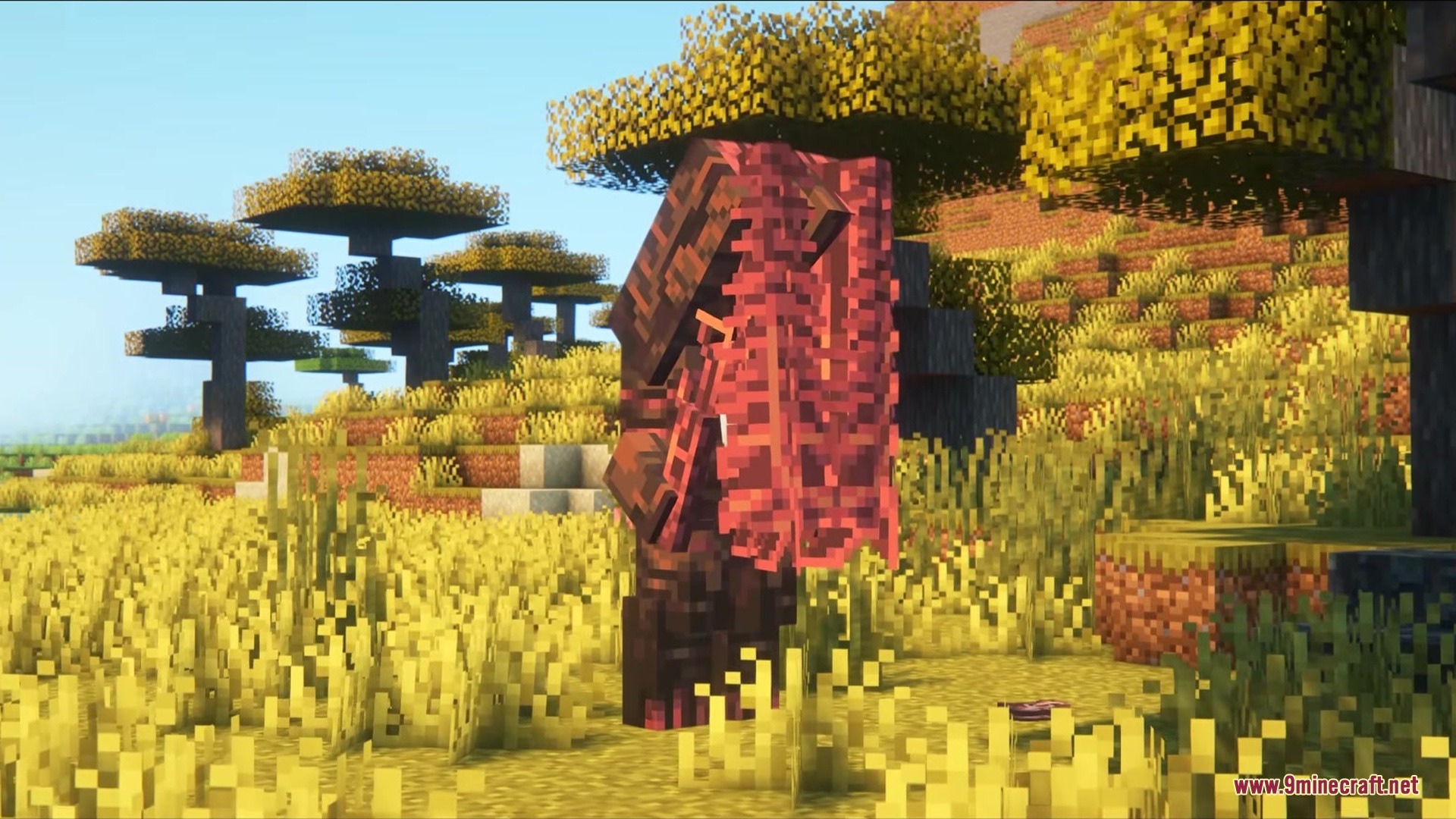 Tall dark creature with red fleshy textures standing in a savanna