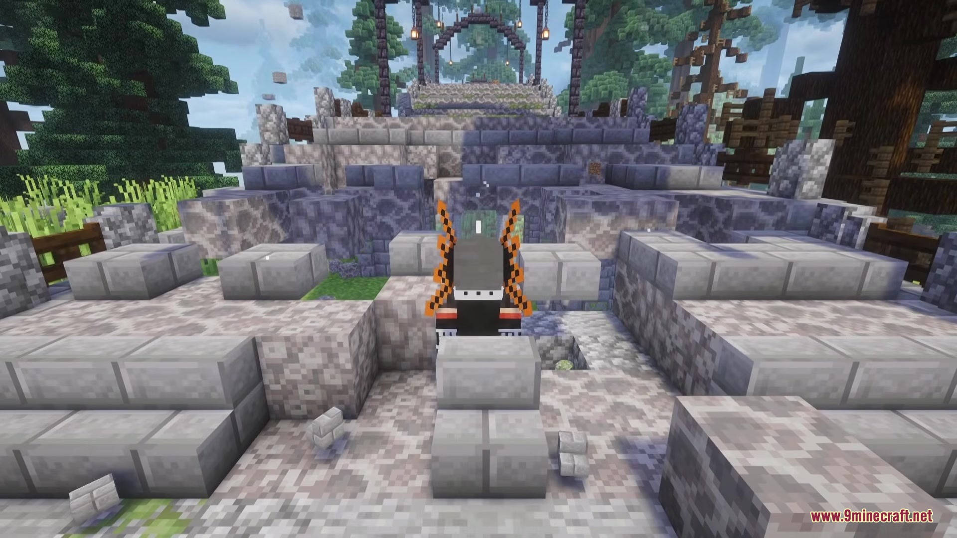 Mine Hero RX Mod Screenshot 5 Player character with orange wings stands on a stone structure in the forest