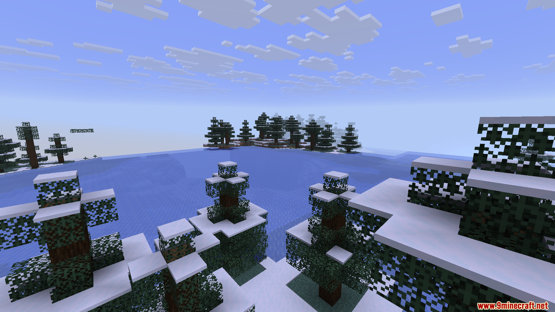 Mini Mega Mod Screenshot 3 A high view of a frozen lake surrounded by snowy spruce trees