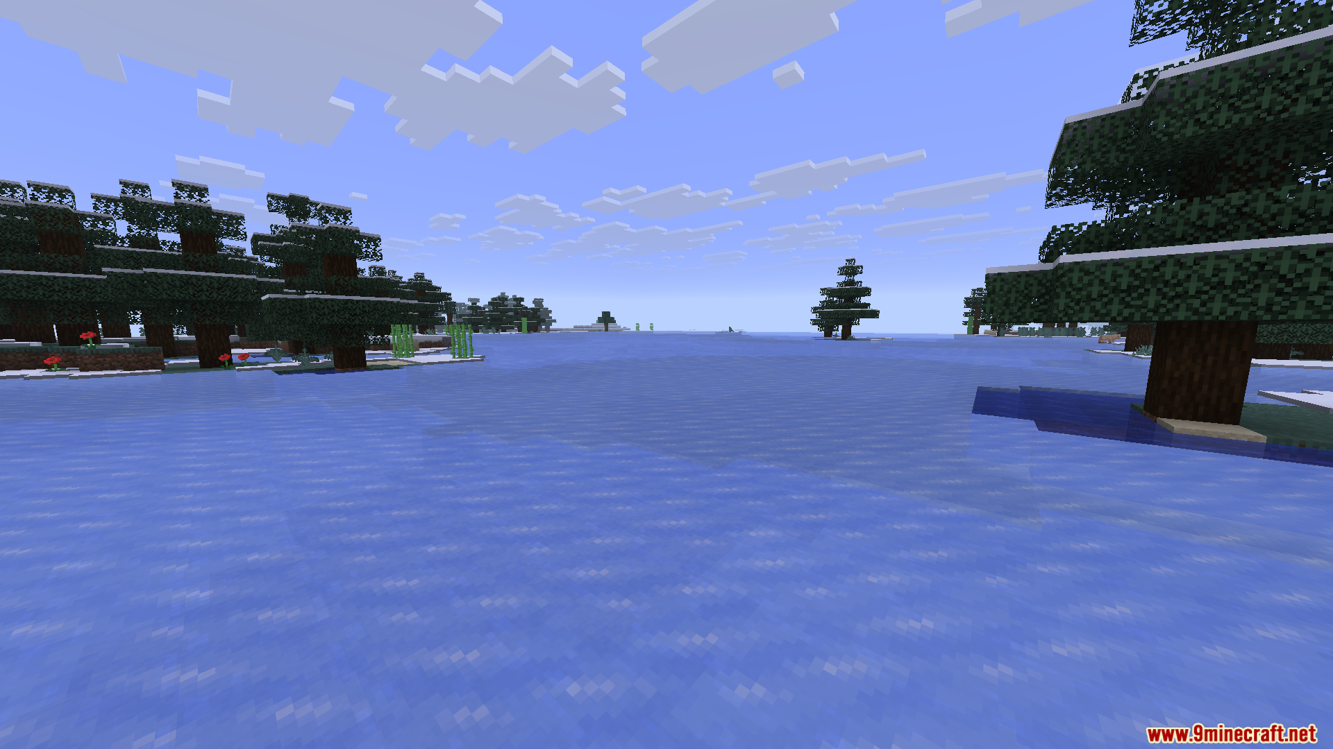 Mini Mega Mod Screenshot 4 A wide frozen lake surrounded by snowy spruce trees and sugar cane