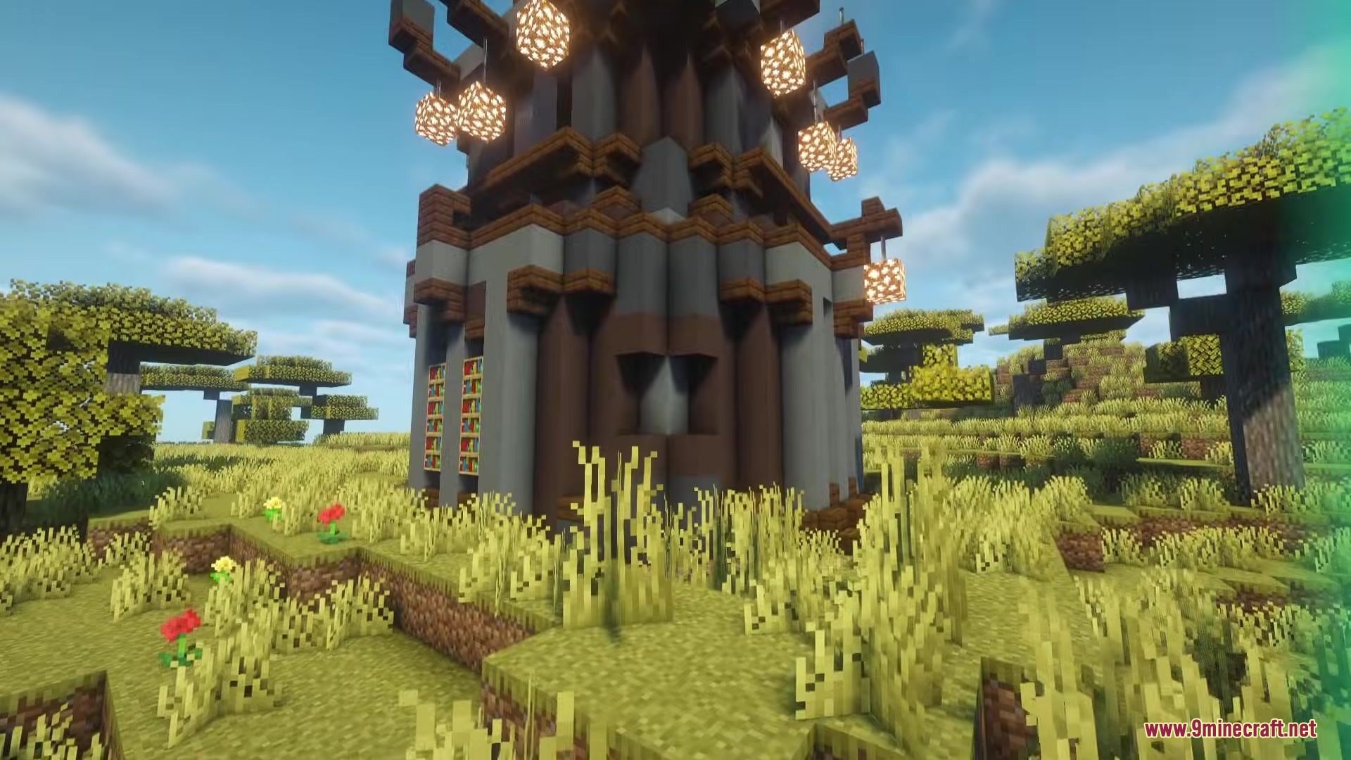 A tall stone tower dungeon with hanging lanterns in a savanna biome