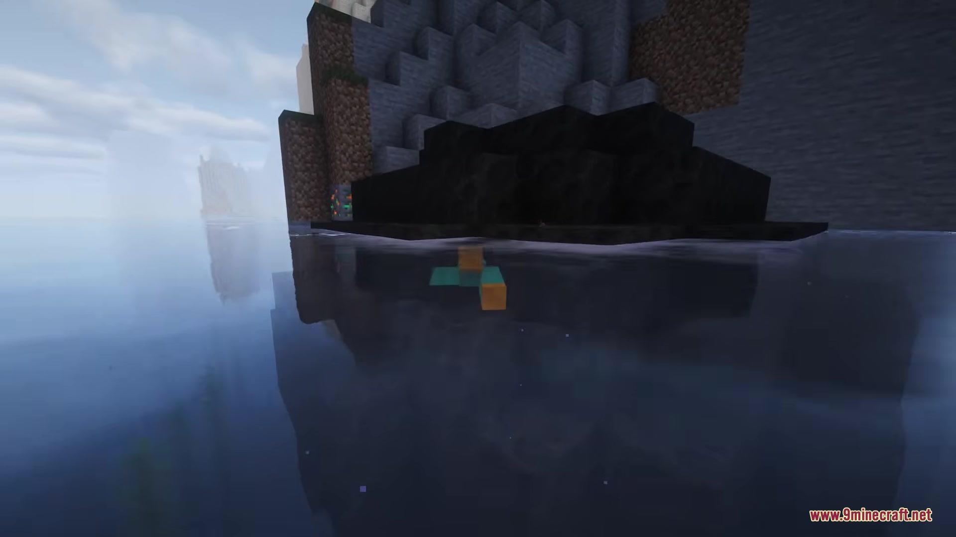 A meteor safely buried underwater near a cliff without damaging the landscape