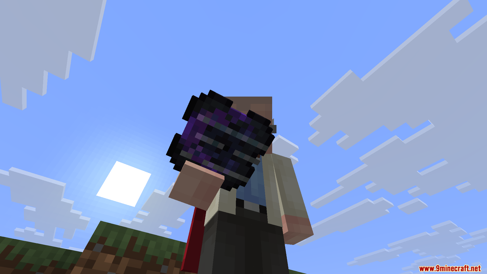 A Minecraft character holds a glowing purple storage cell against the sky