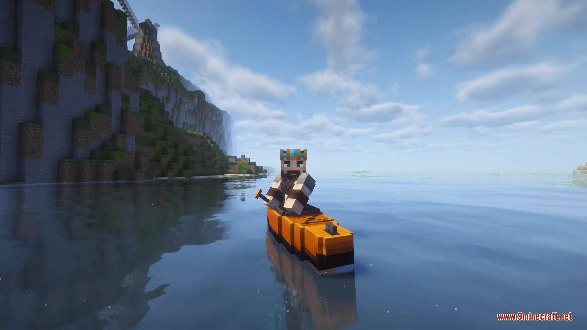A Minecraft player paddles an orange kayak near a cliff in Outback Kayak Mod