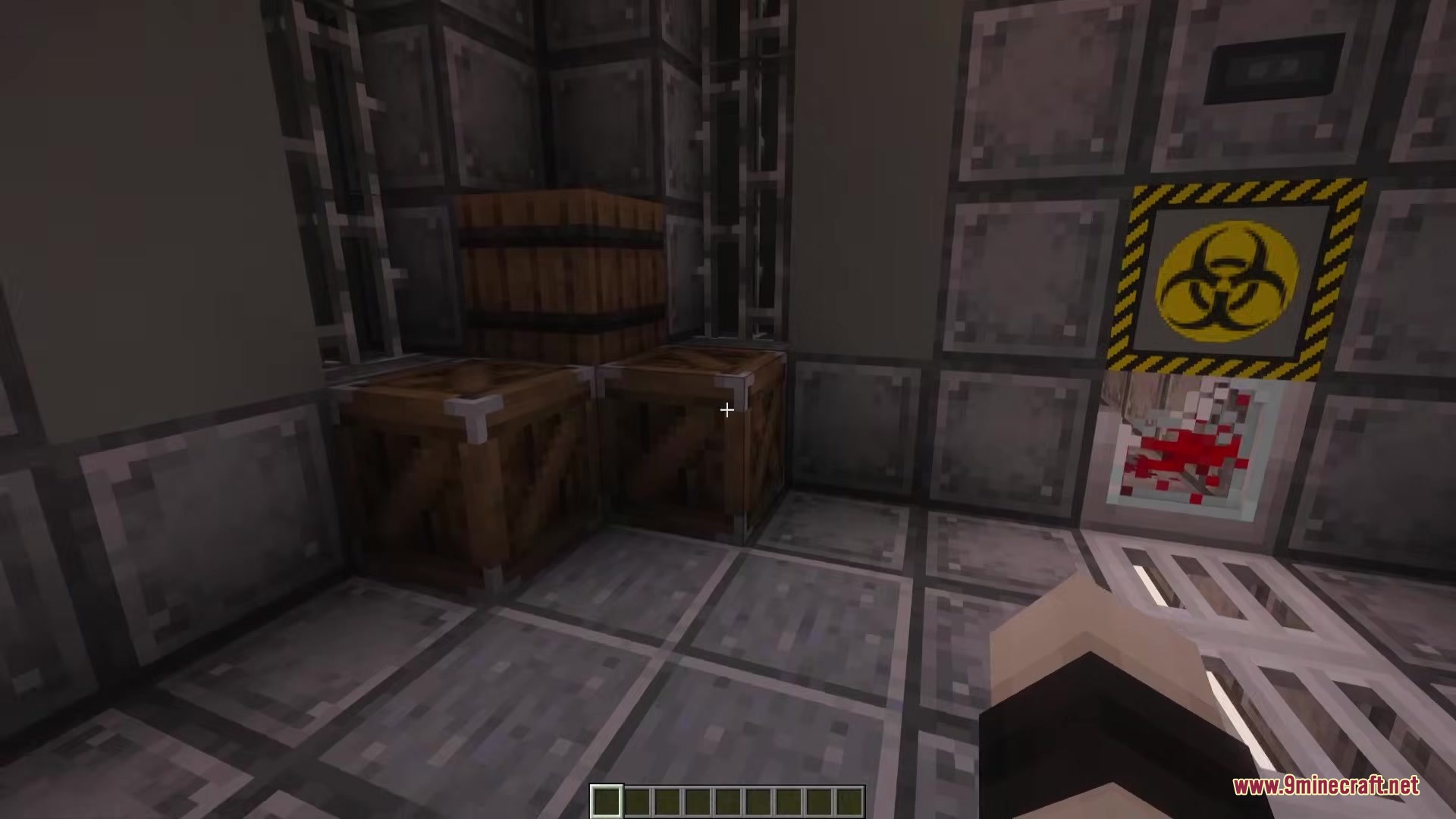 Outpost Zero Mod Screenshot 3 Storage crates and a biohazard sign inside a dark underground bunker