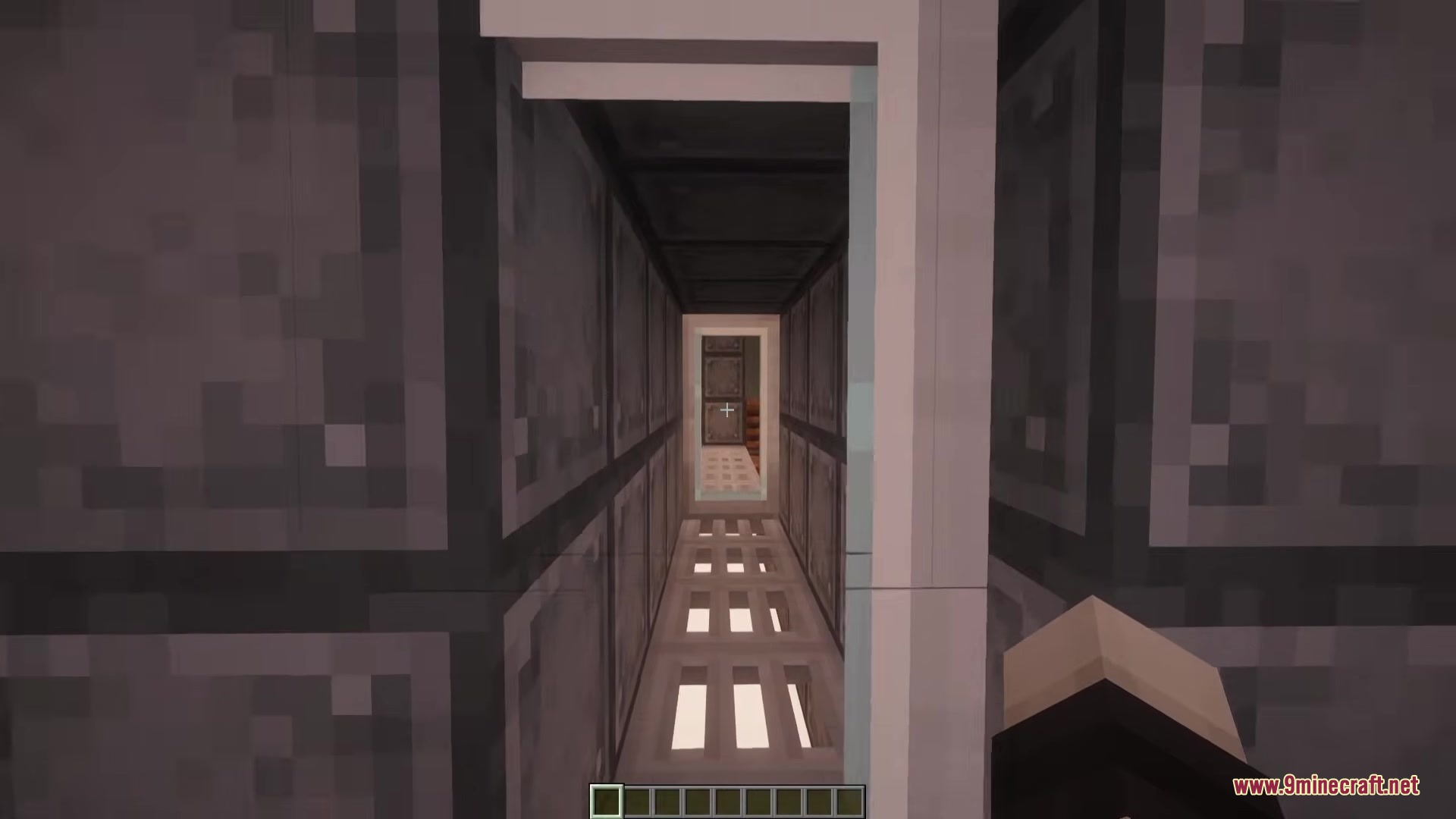 Outpost Zero Mod Screenshot 4 A narrow metal hallway with grated floors inside an abandoned bunker