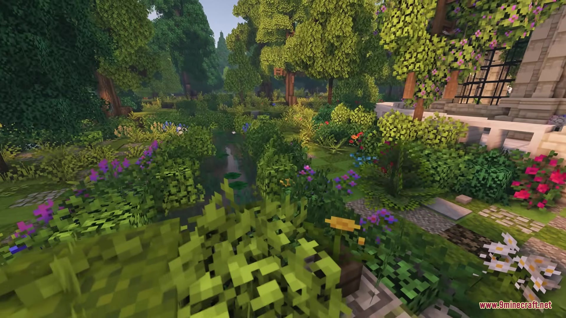 Owange's Autumn Overlay Resource Pack Screenshot 2 A peaceful garden landscape with a small stream and many colorful flowers