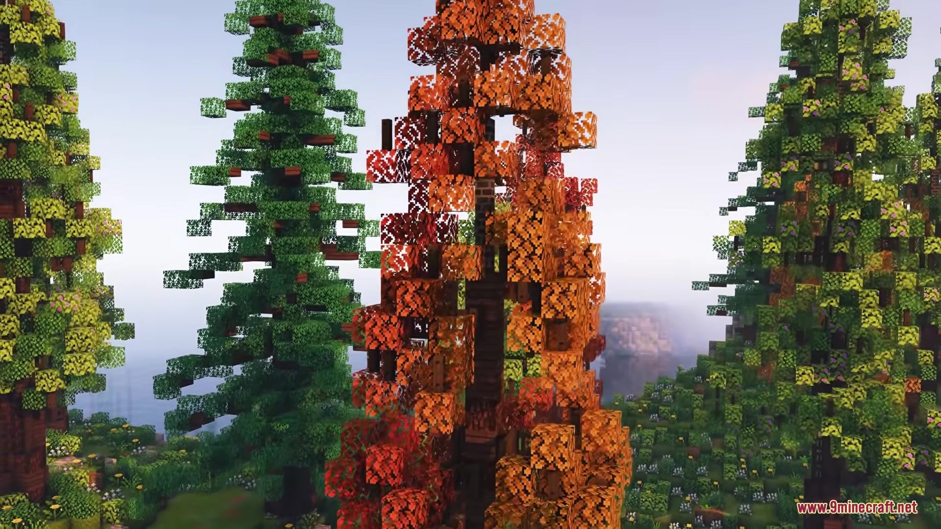 Owange's Autumn Overlay Resource Pack Screenshot 9 Tall trees with bright orange and red leaves in a Minecraft autumn landscape