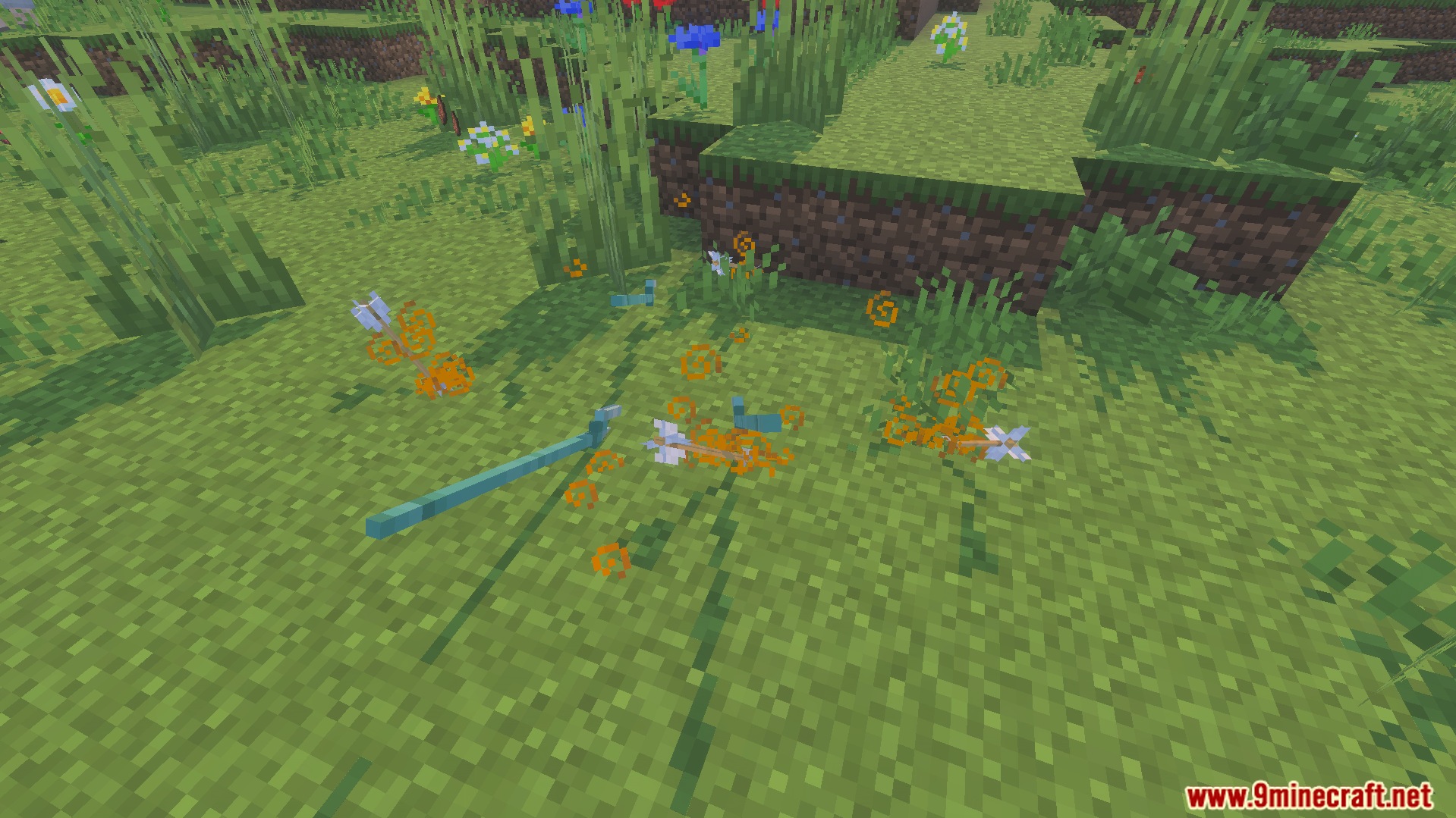 Dropped items and arrows on the grass with orange particles to improve game speed