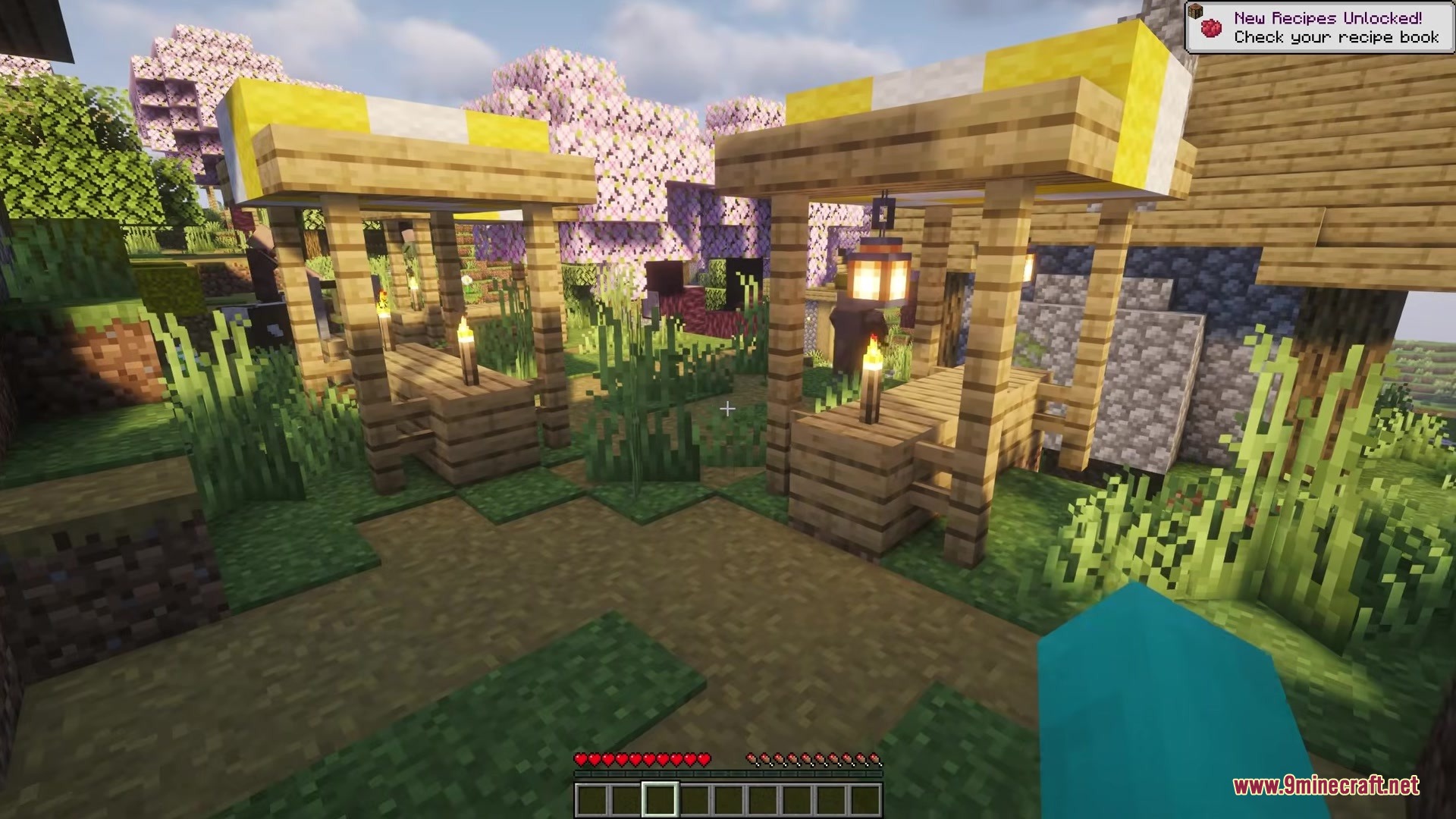 Picker Upper Mod Screenshot 6 Wooden market stalls with lanterns and torches in a cherry blossom village