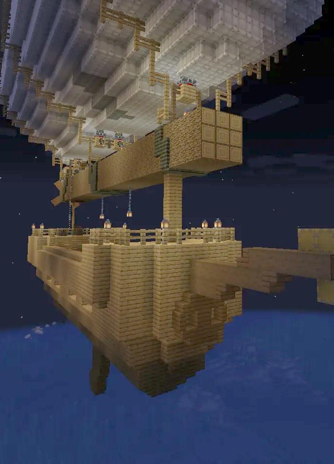 The Piggie Airship with a large white balloon flying over the ocean at night