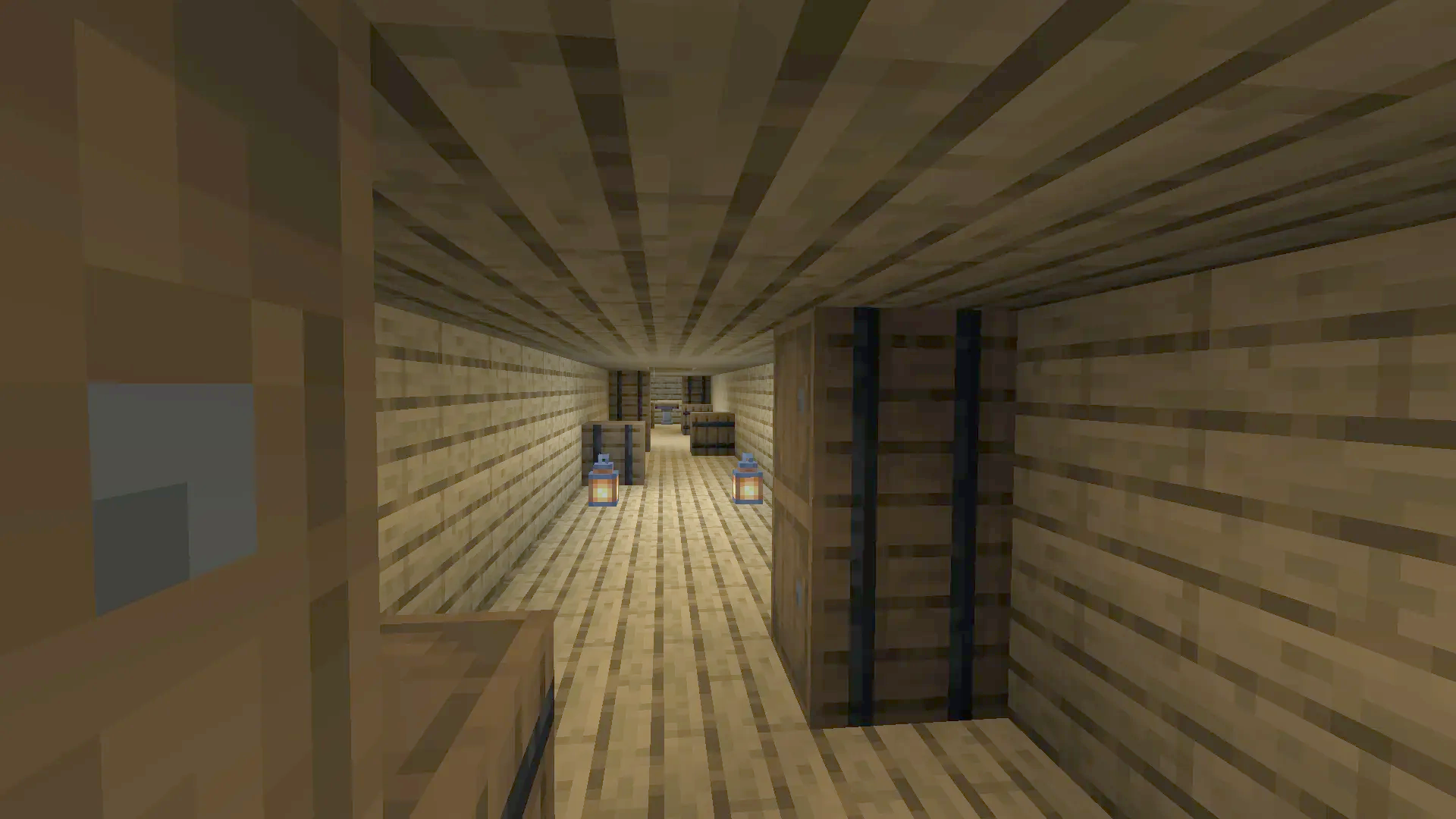 A narrow wooden hallway inside the airship with lanterns and storage barrels