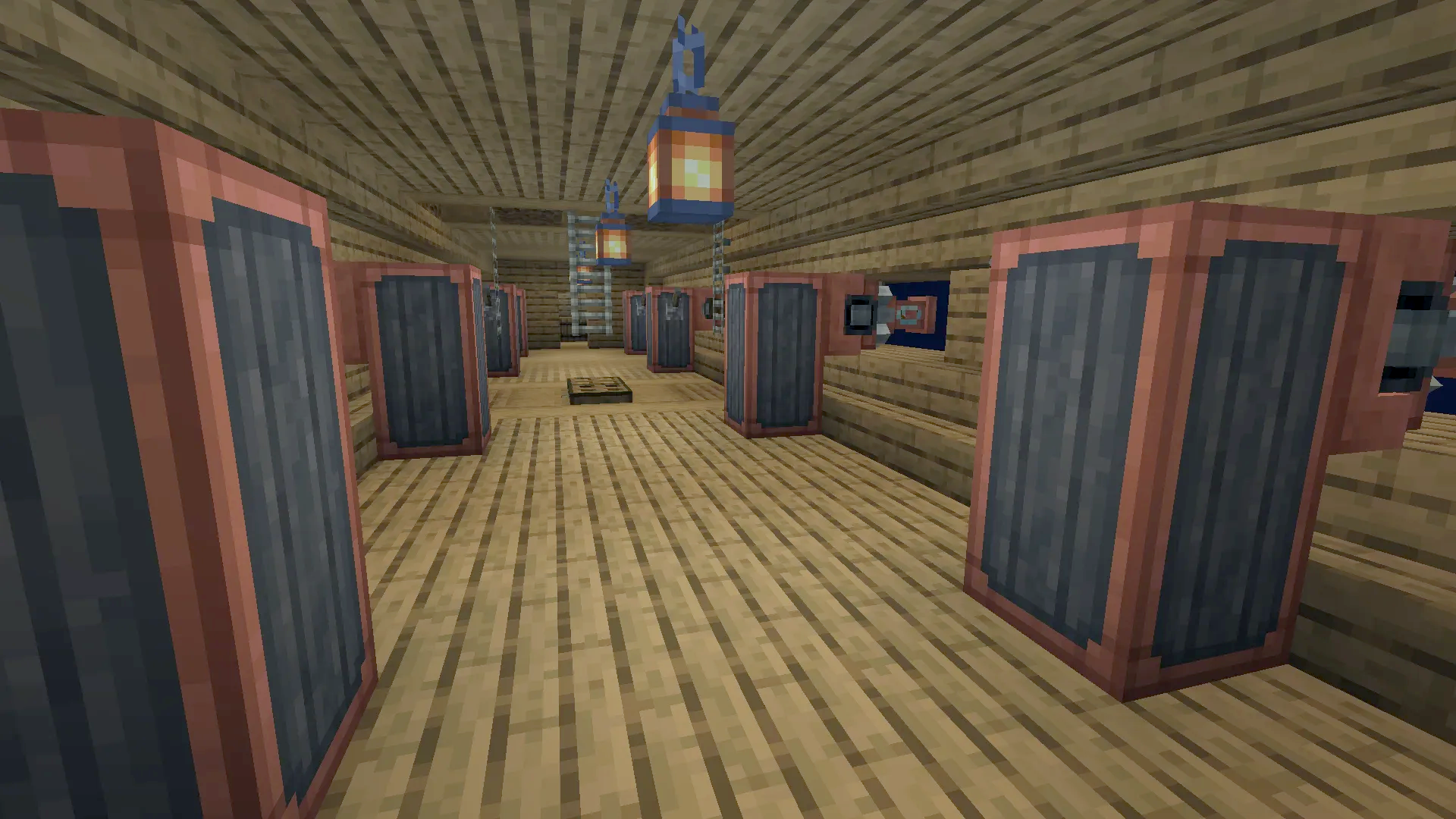 The cannon room of the airship featuring several large weapons and lanterns