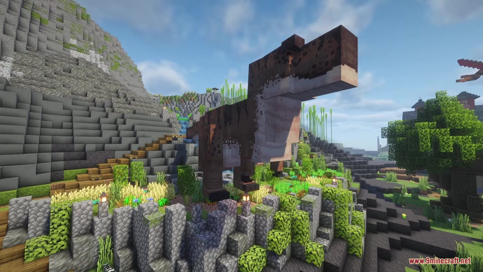 A large brown Tyrannosaurus Rex stands in a scenic Minecraft mountain landscape