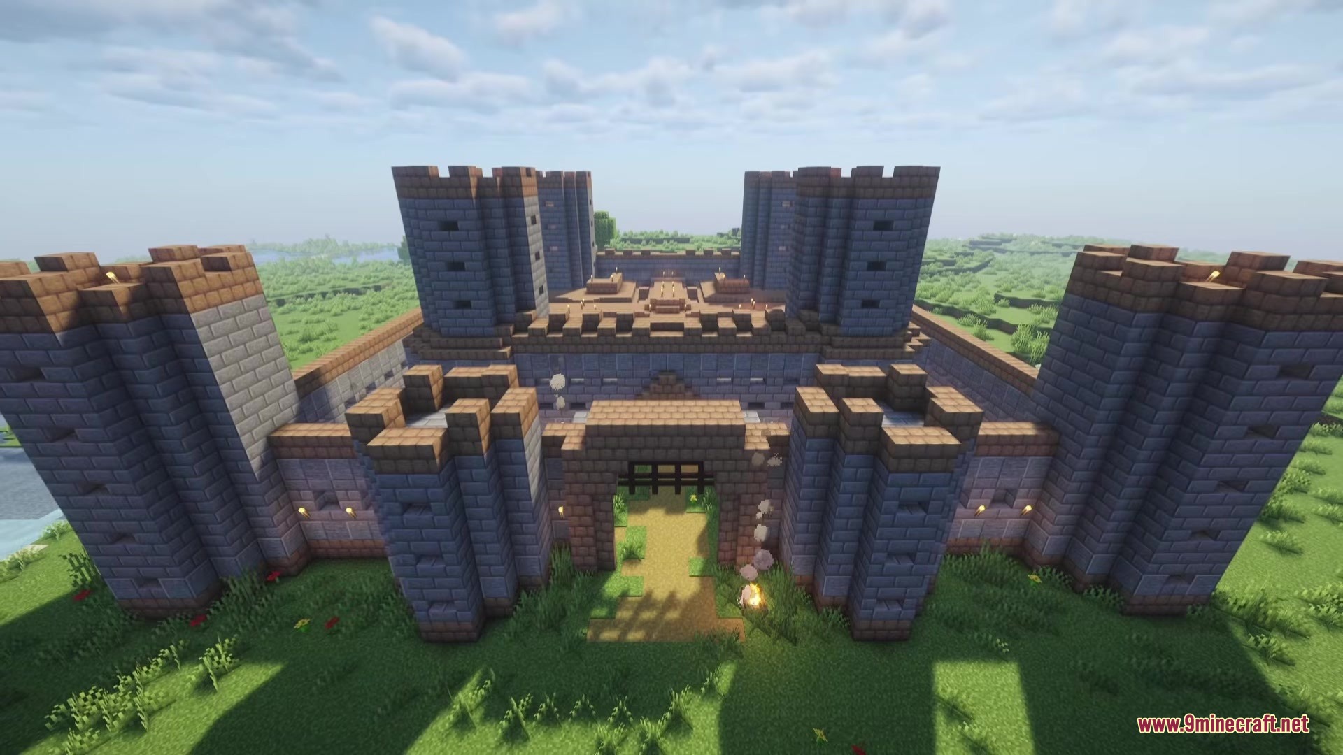 Proyect Berserk Mod Screenshot 3 A massive stone castle with multiple towers stands in a grassy landscape