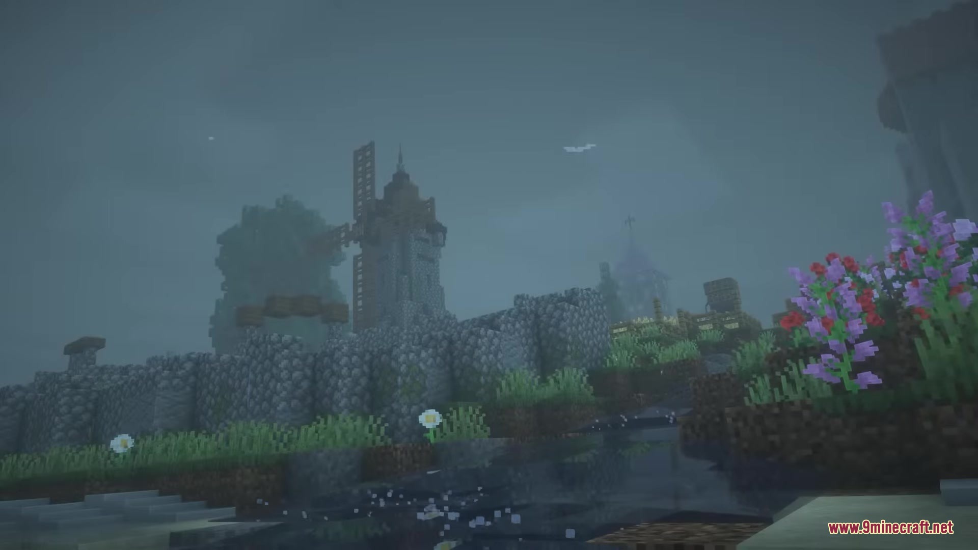 Punchy FPA Mod Screenshot 5 Foggy Minecraft landscape with stone walls and a distant windmill tower