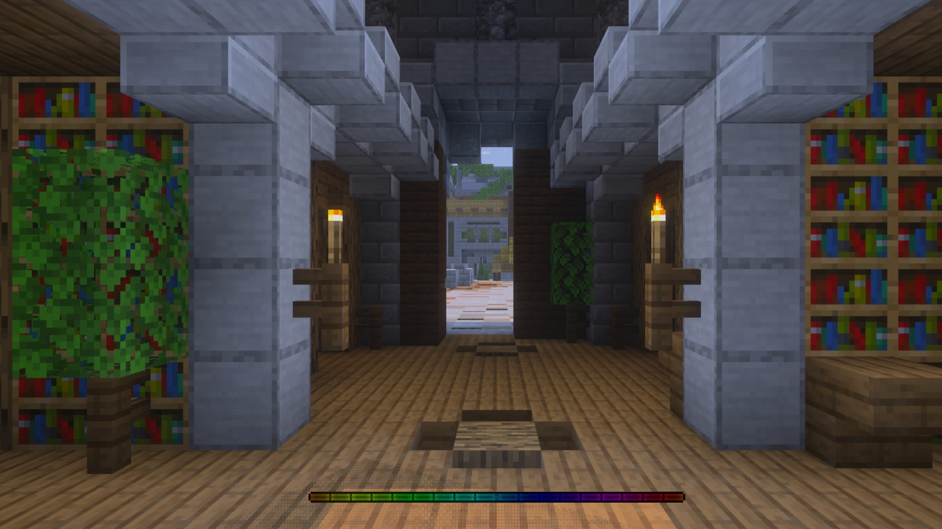 Interior view of a library with a moving rainbow colored experience bar