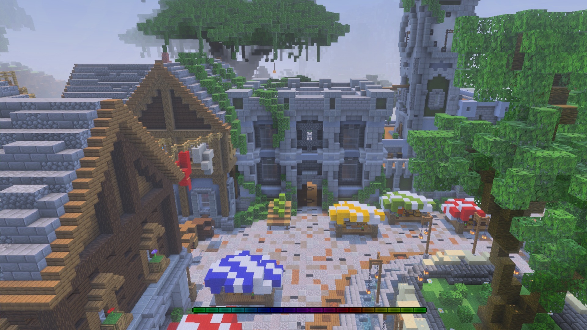Overhead view of a village market square with a rainbow experience bar