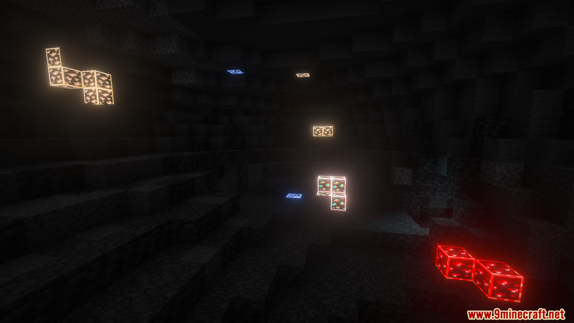 Vivid glowing ores stand out against the dark stone of a deep cave