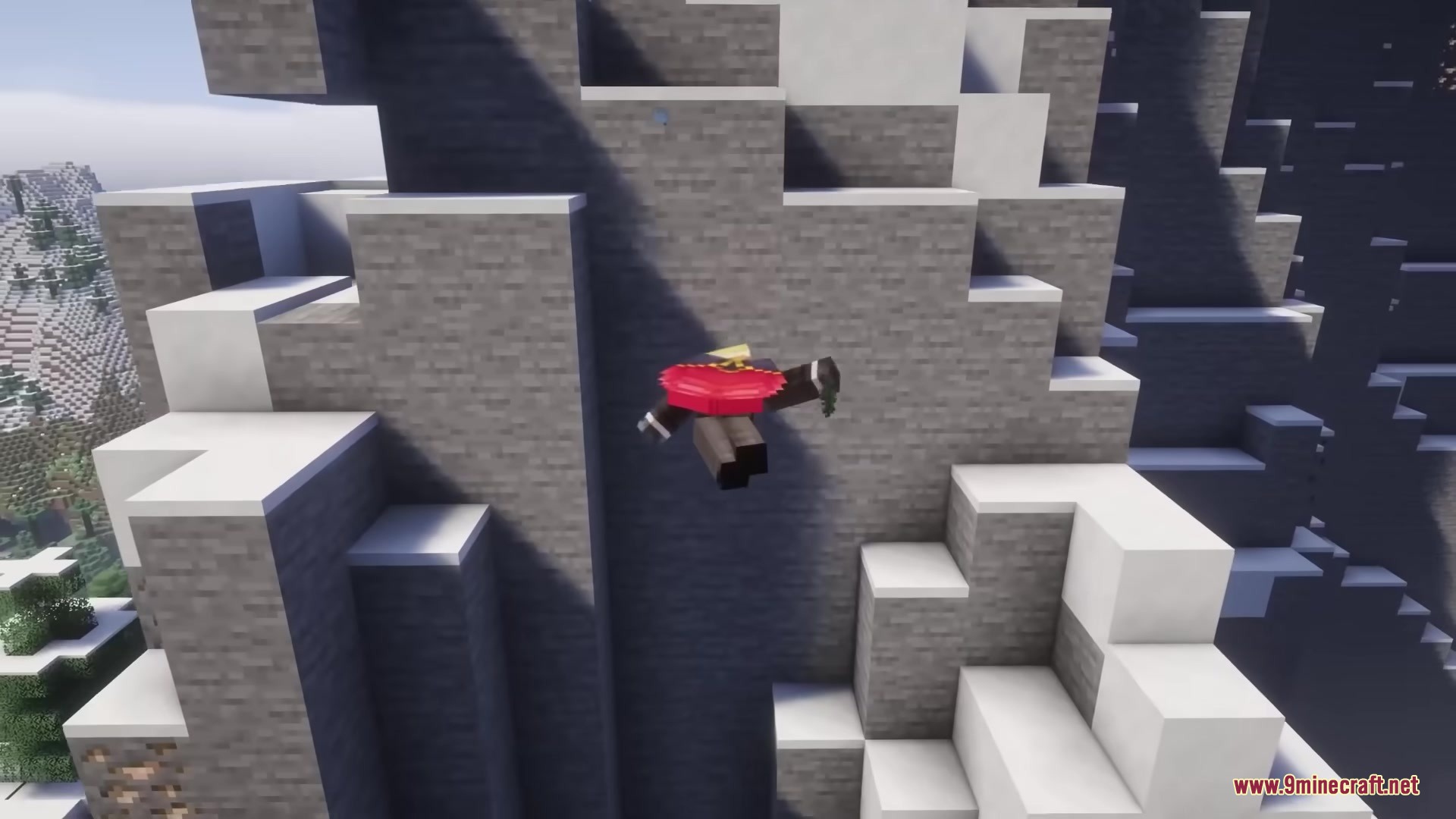 A player character tumbles through the air next to a steep stone mountain
