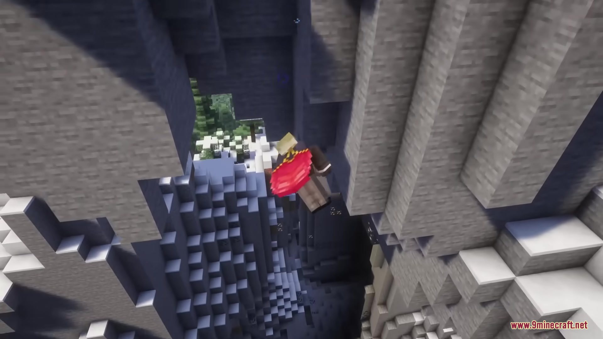 A player with a red cape tumbles through a narrow stone ravine
