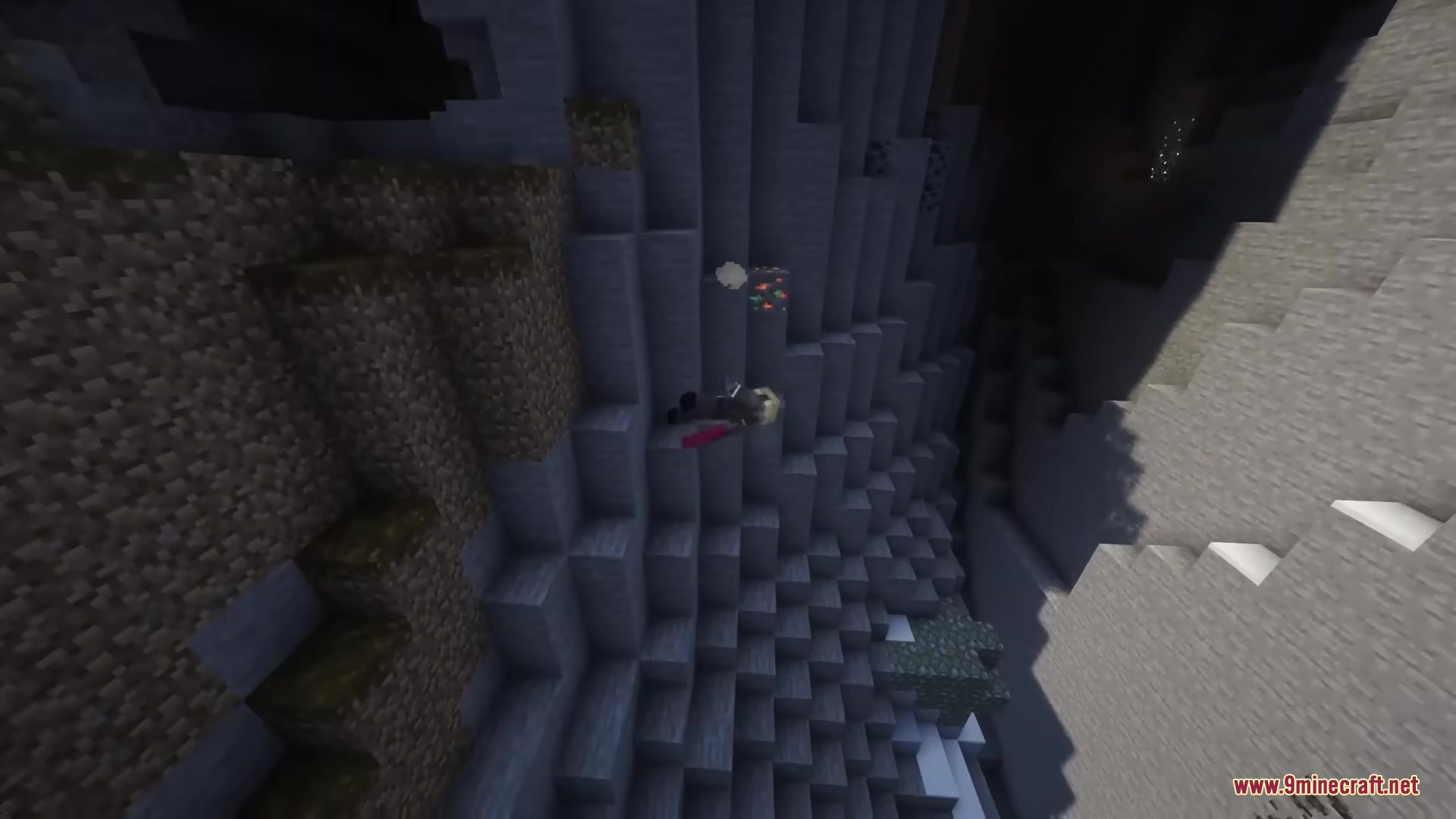 The character falls down a steep stone canyon with floppy ragdoll physics effects
