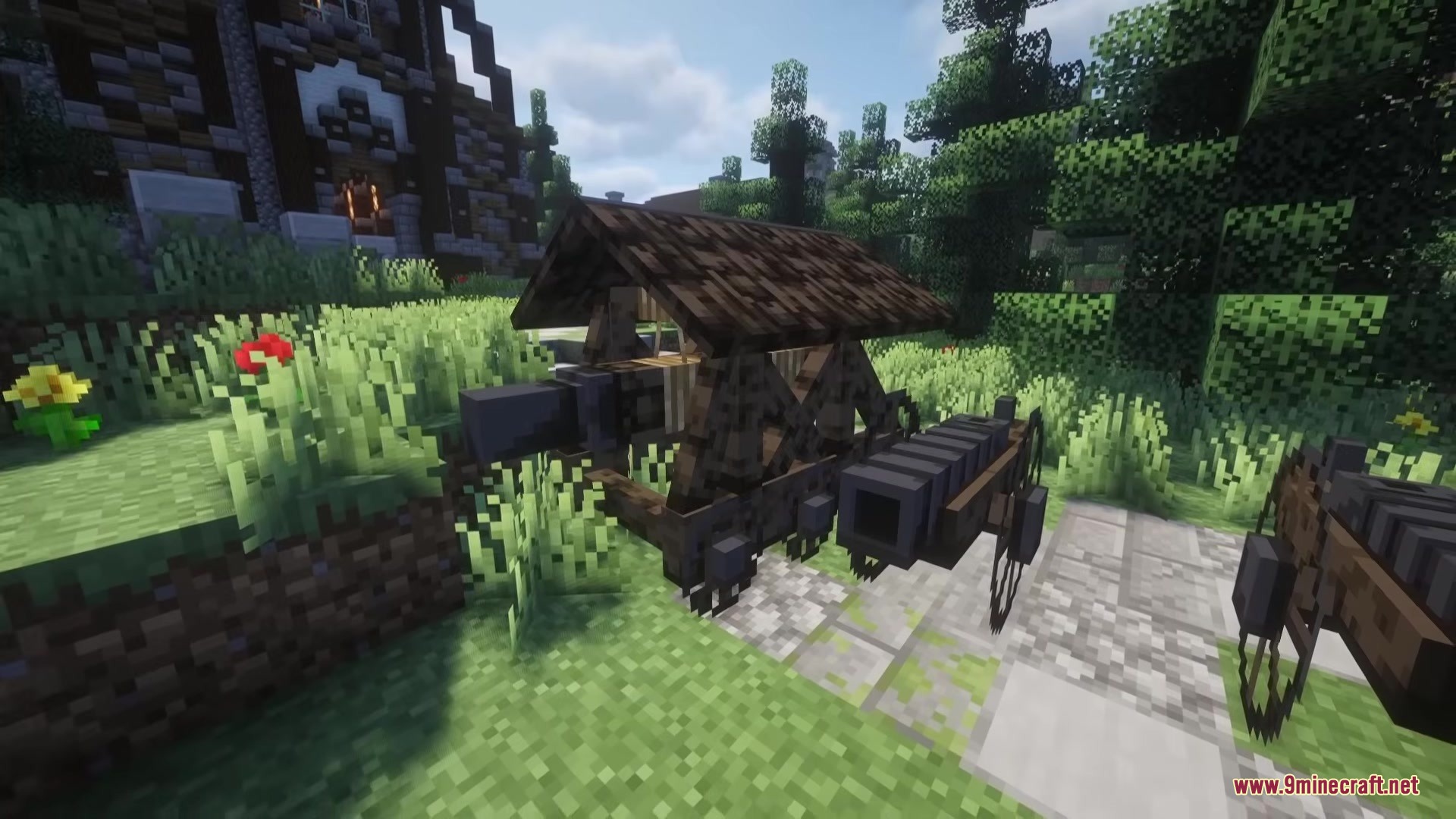 A wooden cannon sits on a stone path in a lush garden