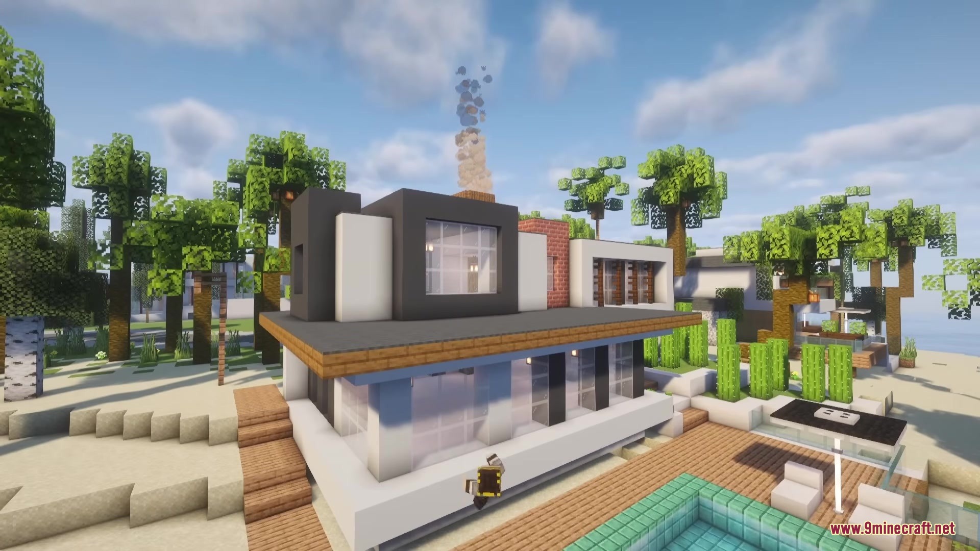 A luxurious modern house with a swimming pool and palm trees in Minecraft
