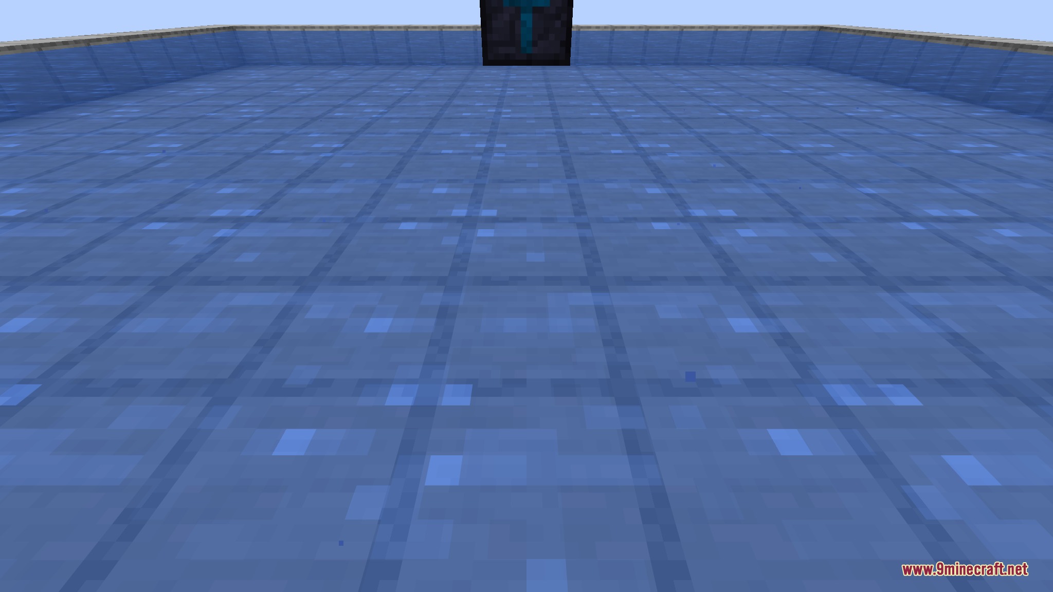 Close-up of the pump block face hovering just above the water surface