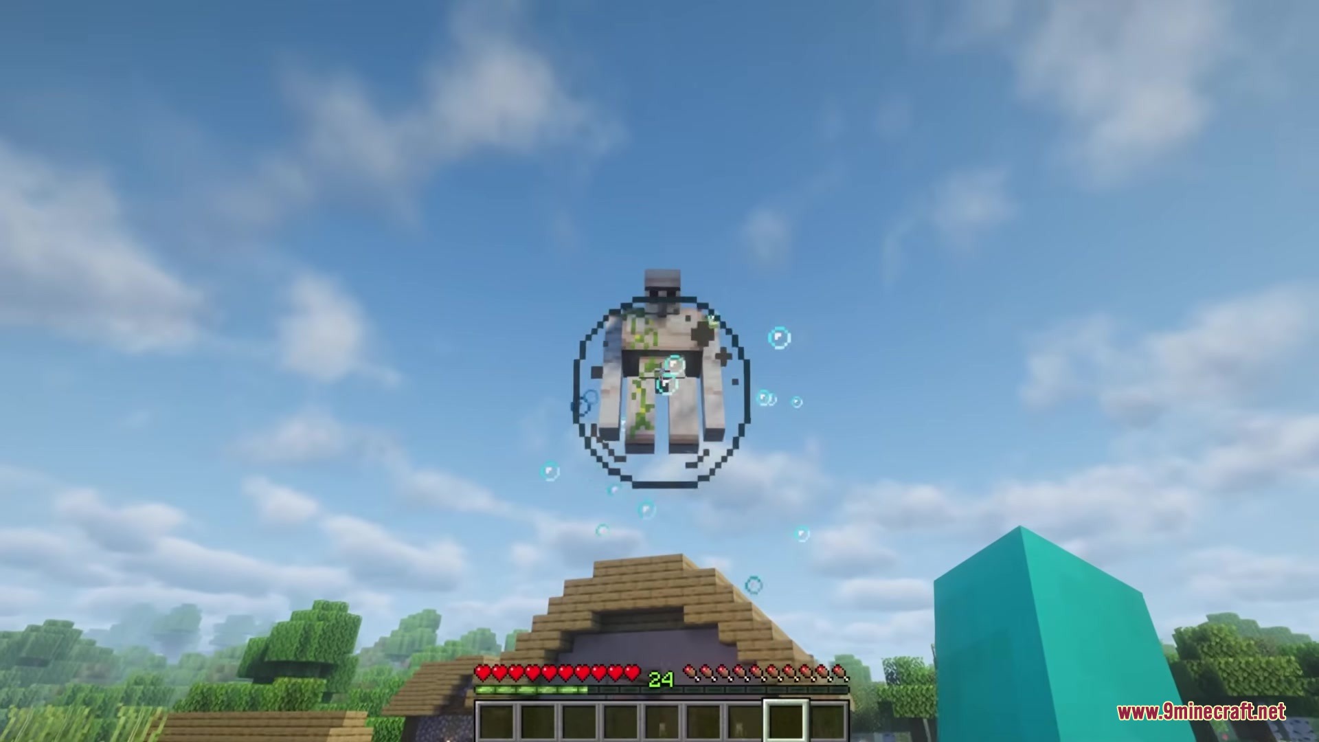 Redomesticate Mod Screenshot 10 An Iron Golem floats inside a bubble high above a village house