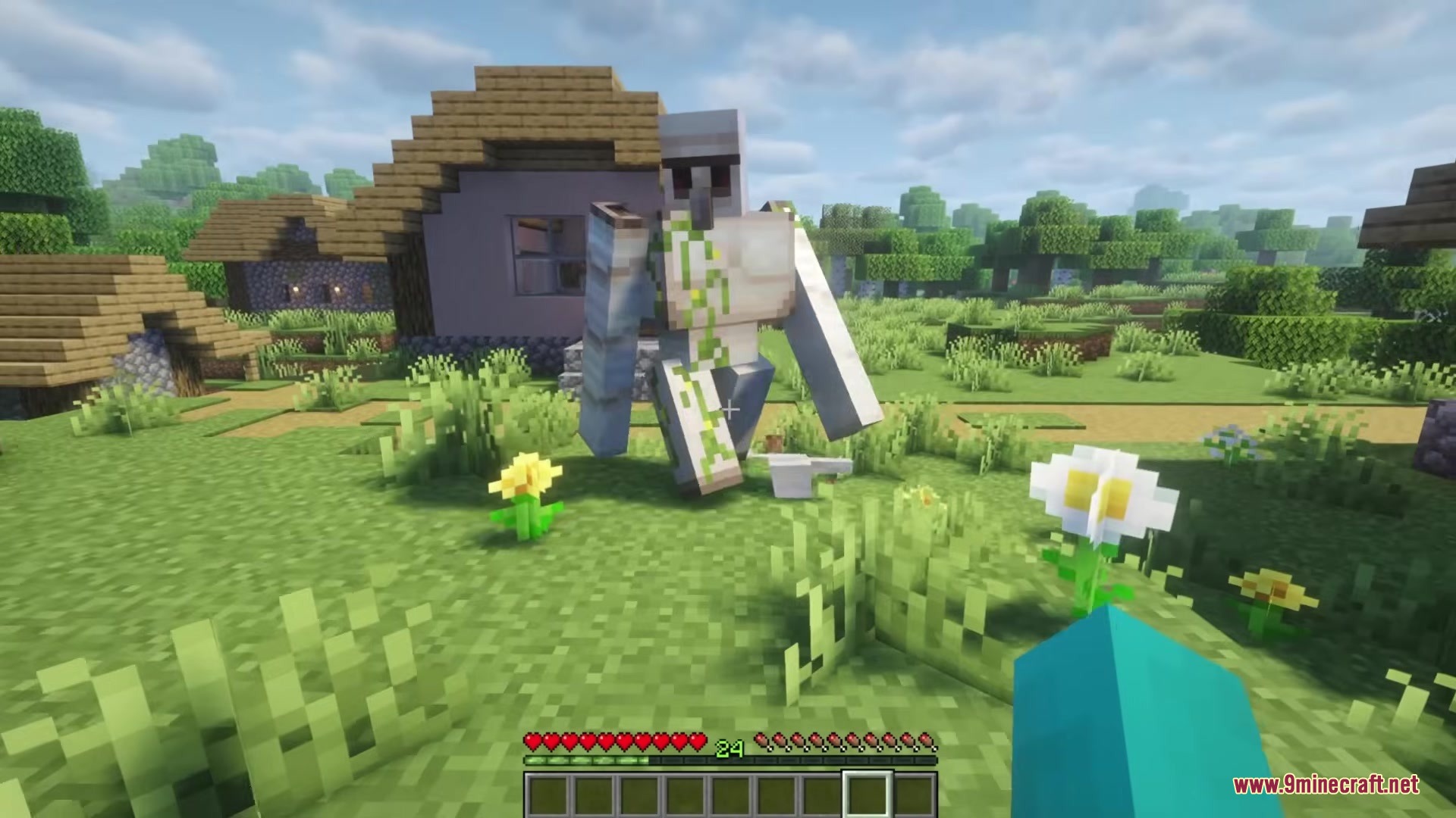 Redomesticate Mod Screenshot 9 A cracked Iron Golem stands in a village near a small house
