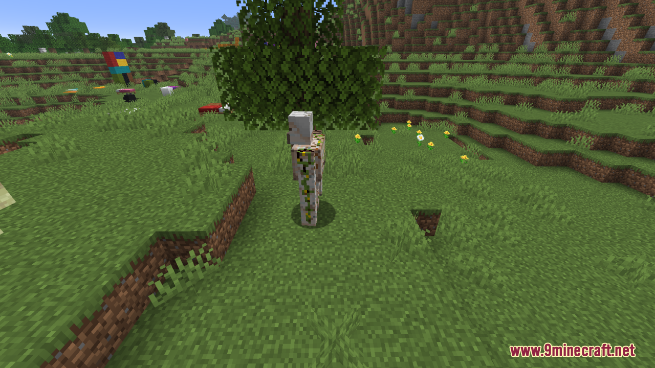 Reduce the Vignette Effect Resource Pack Screenshot 2 An iron golem standing in a grassy field near a tree and flowers