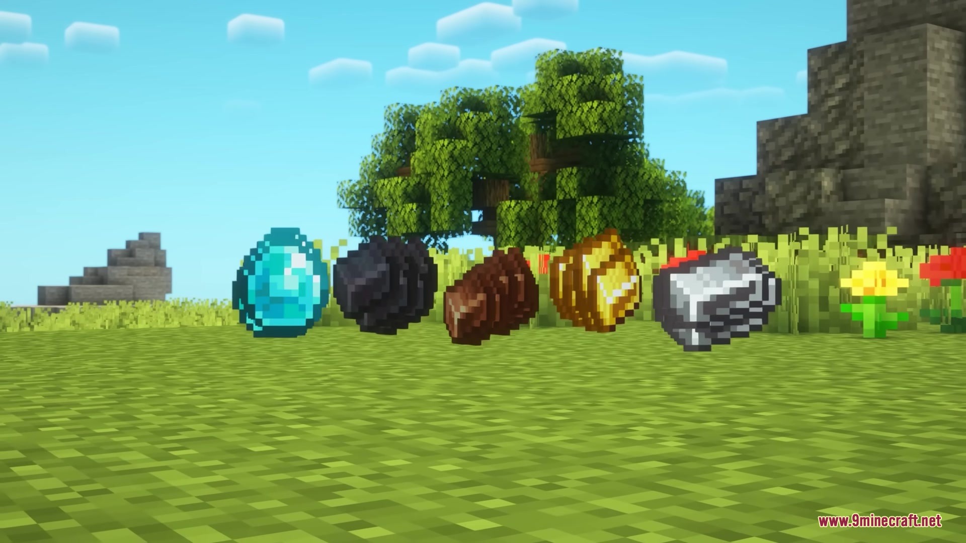 Diamond and raw ores floating in a line on the green grass
