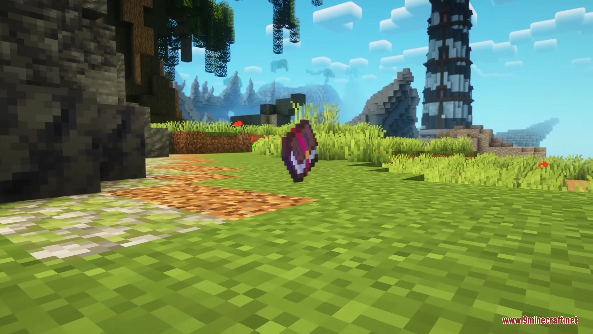 An enchanted book floating above a dirt path with a tower background