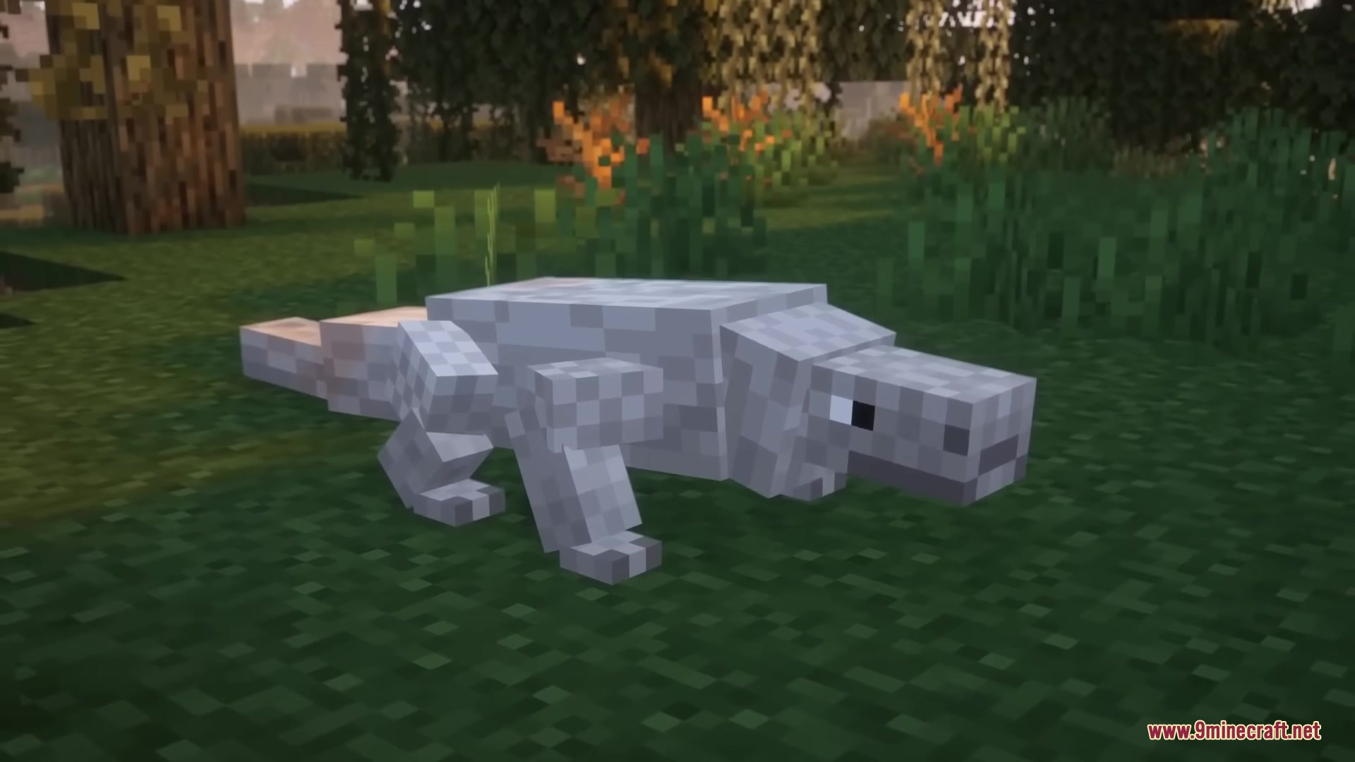 Reptilian Mod Screenshot 1 A grey Komodo Dragon lizard stands on the grass in a forest