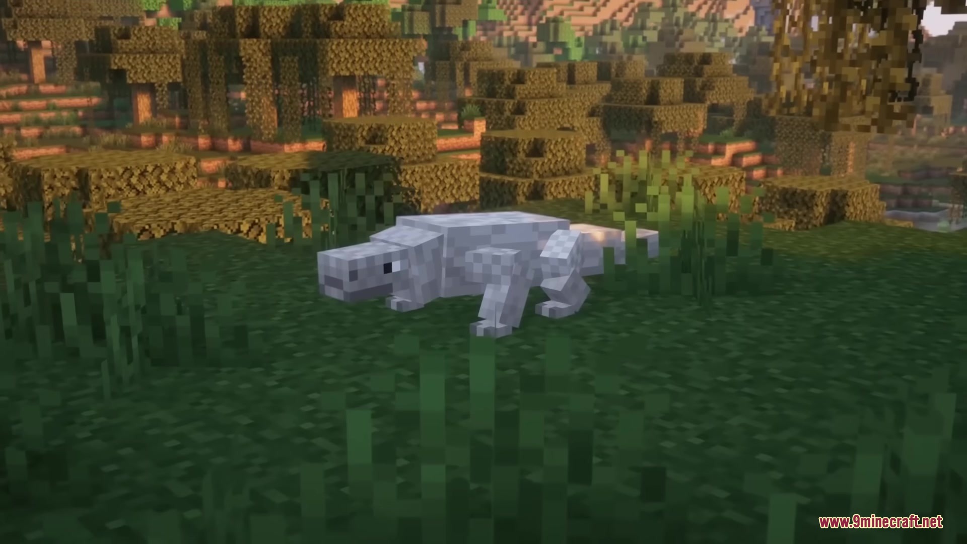 Reptilian Mod Screenshot 6 A large grey Komodo dragon crawls through a grassy Minecraft forest biome