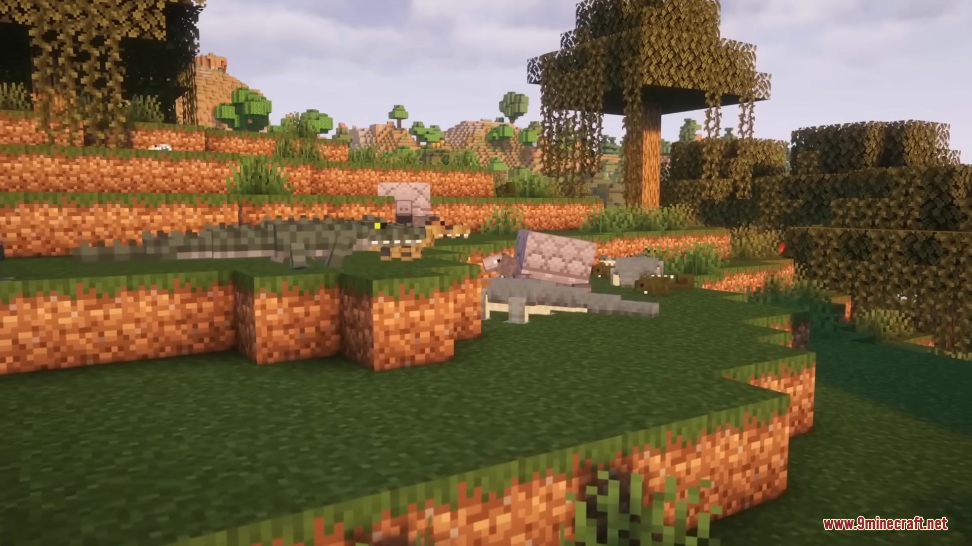 Reptilian Mod Screenshot 9 A group of crocodiles and lizards resting on a grassy hill in Minecraft