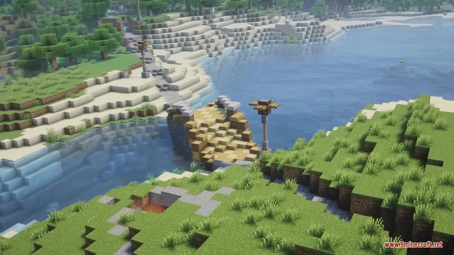 A wooden bridge crosses a river to connect paths in the wilderness