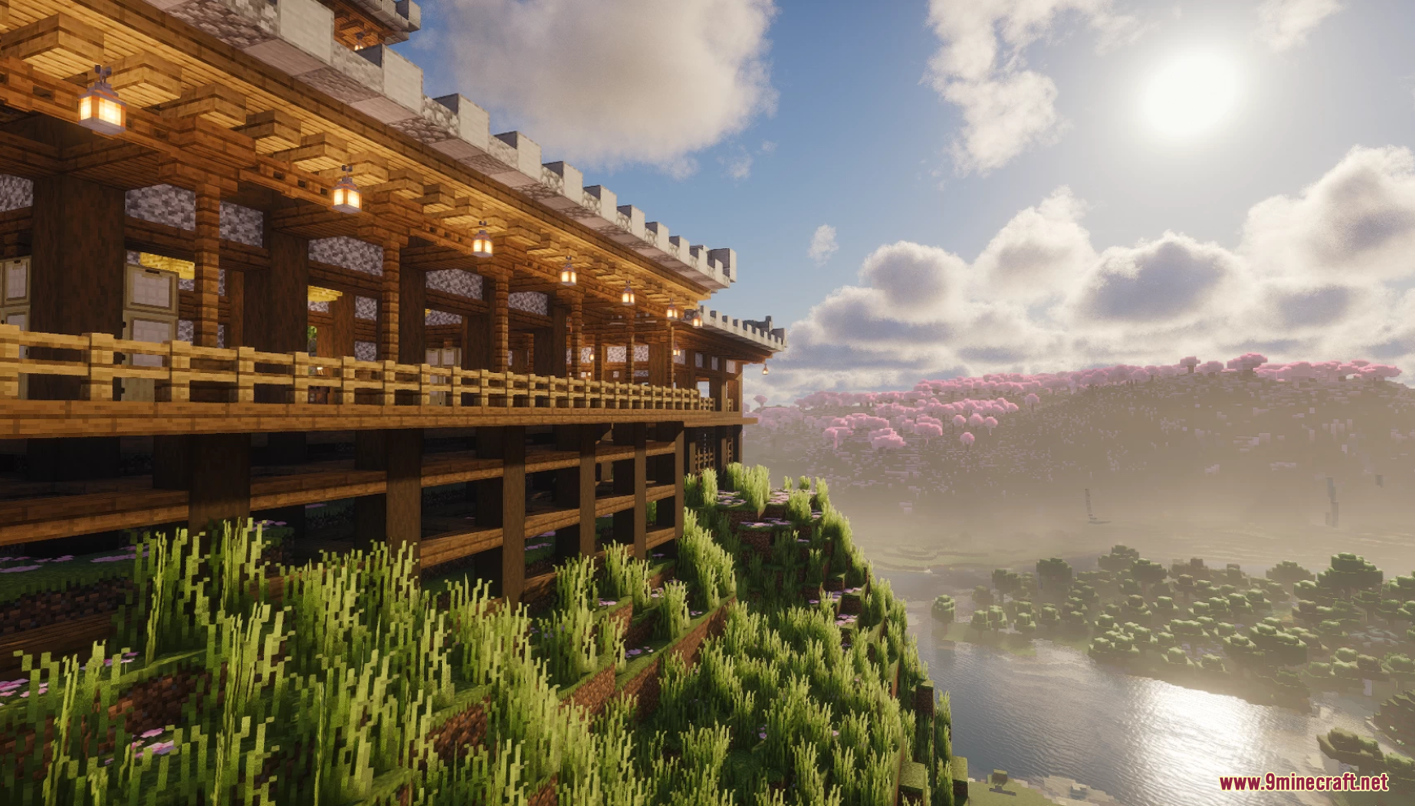 A large Japanese pagoda built on a cliff overlooking a cherry blossom forest