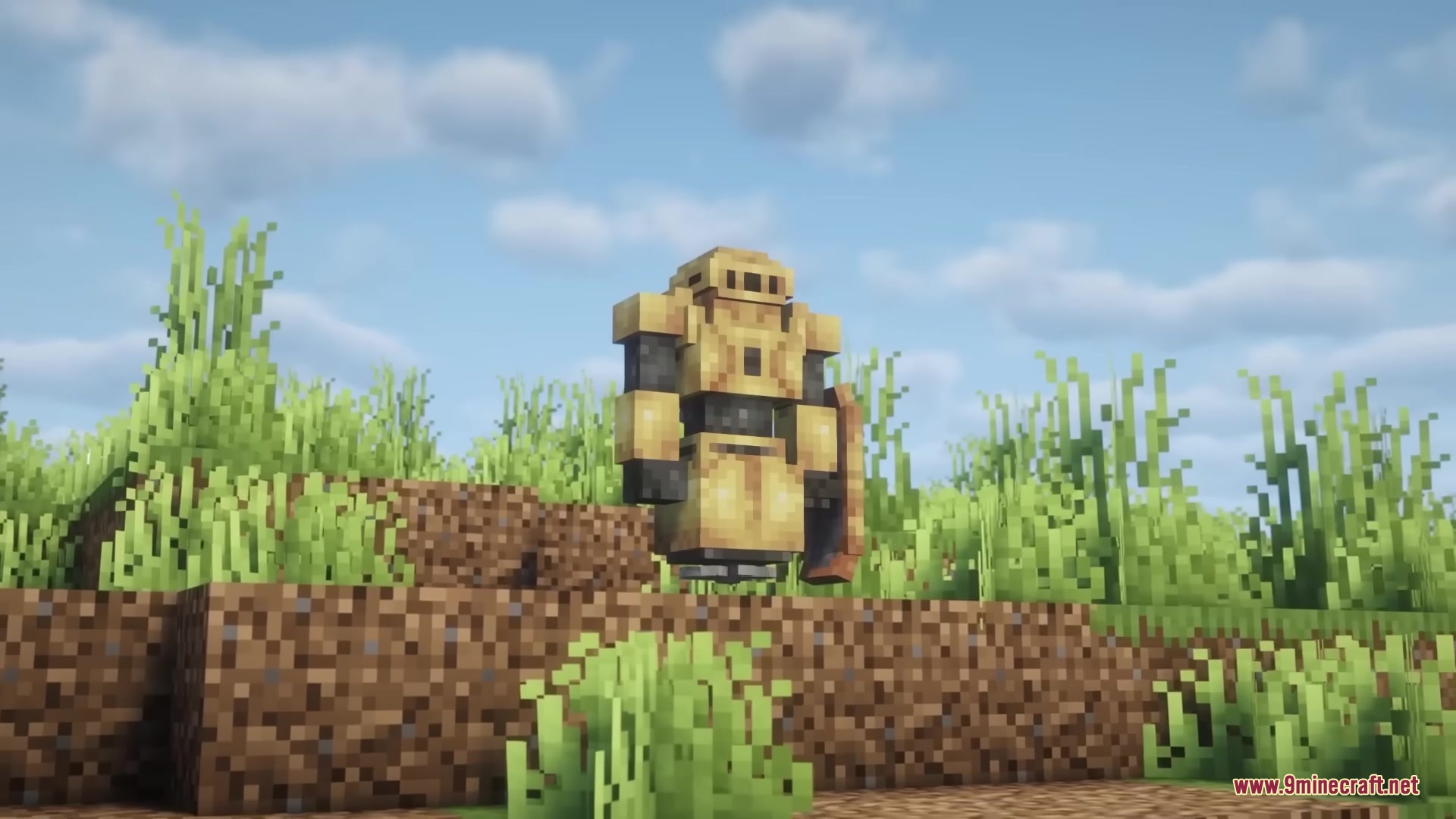 Scorched Guns Neoforged Mod Screenshot 10 A Minecraft character wearing bulky tan ExoSuit armor on a grassy hill
