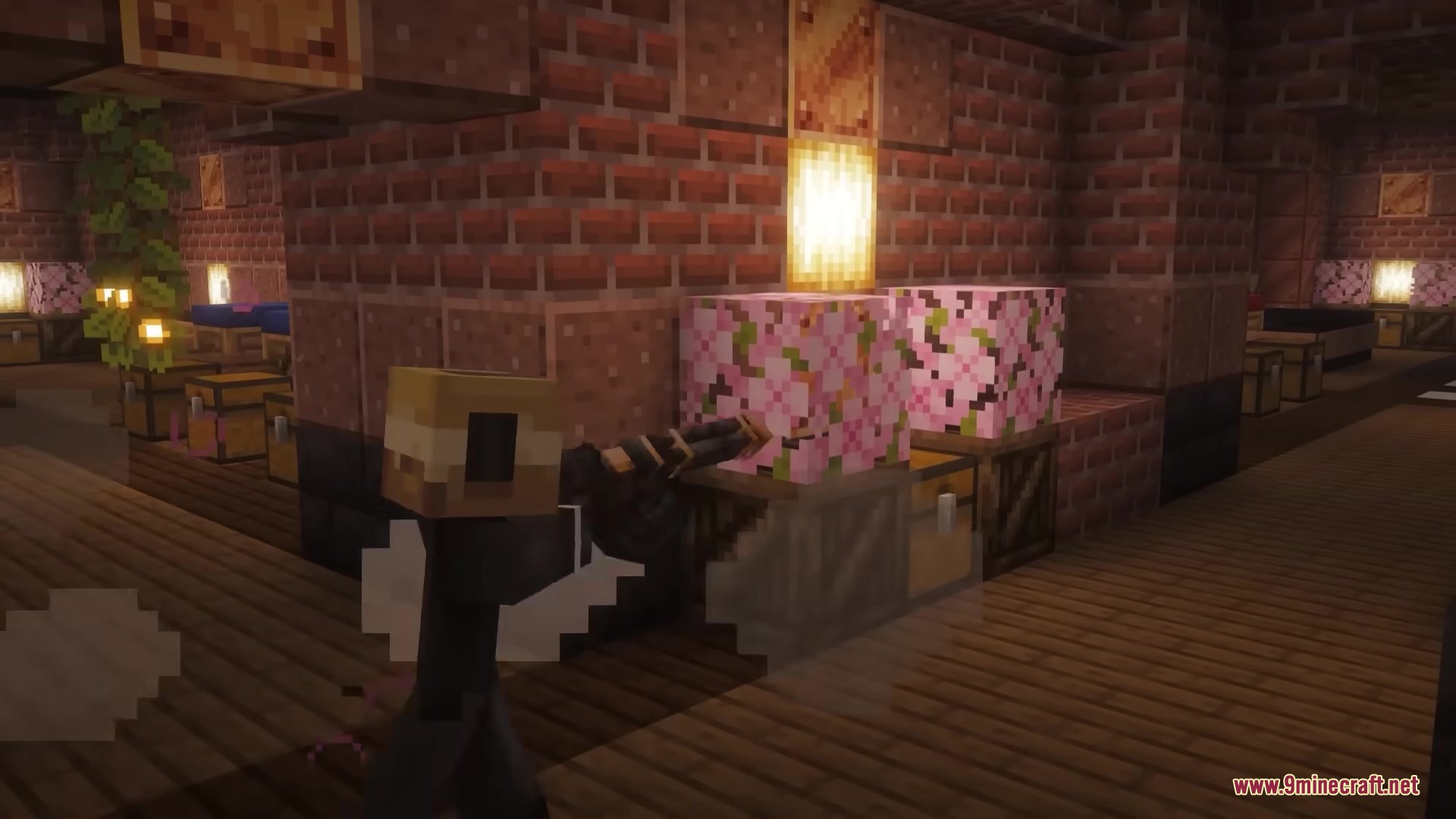 Scorched Guns Neoforged Mod Screenshot 7 Player character holding a firearm inside a brick room with cherry blossom blocks